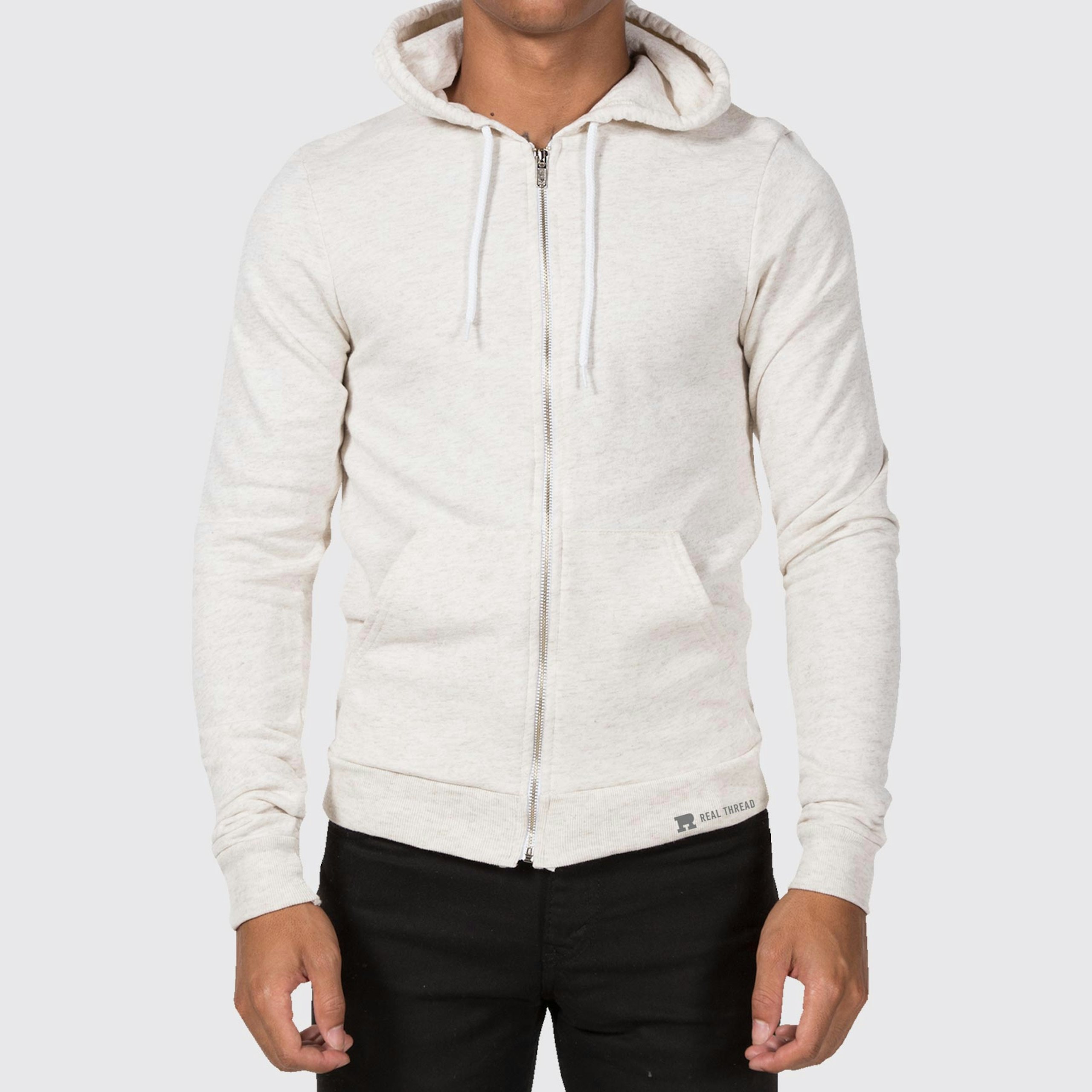 man wearing a light tan zip-up hoodie