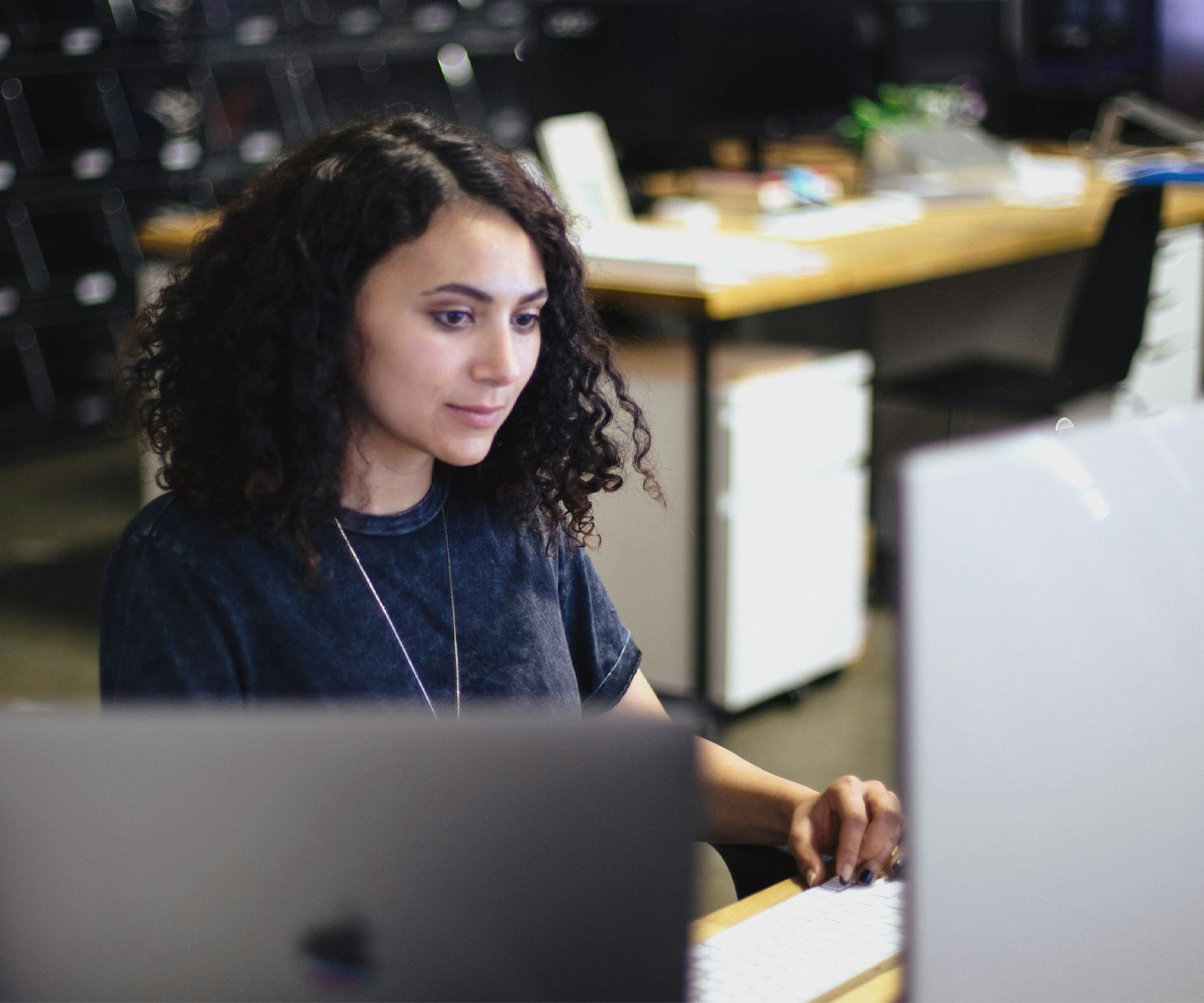 women sitting at a computer