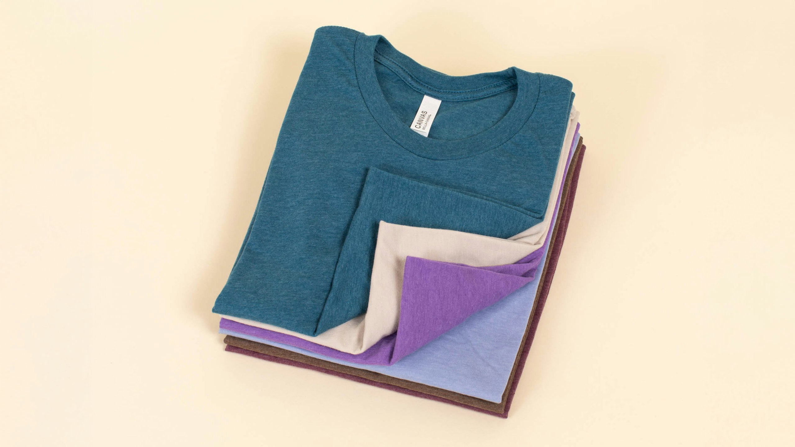 a stack of folded t-shirts