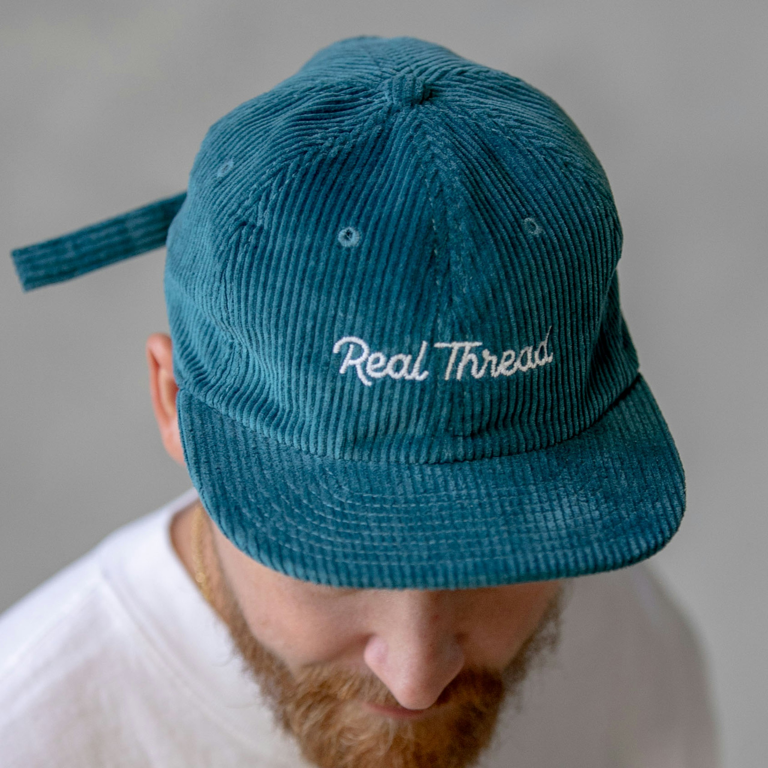 man wearing a blue hat