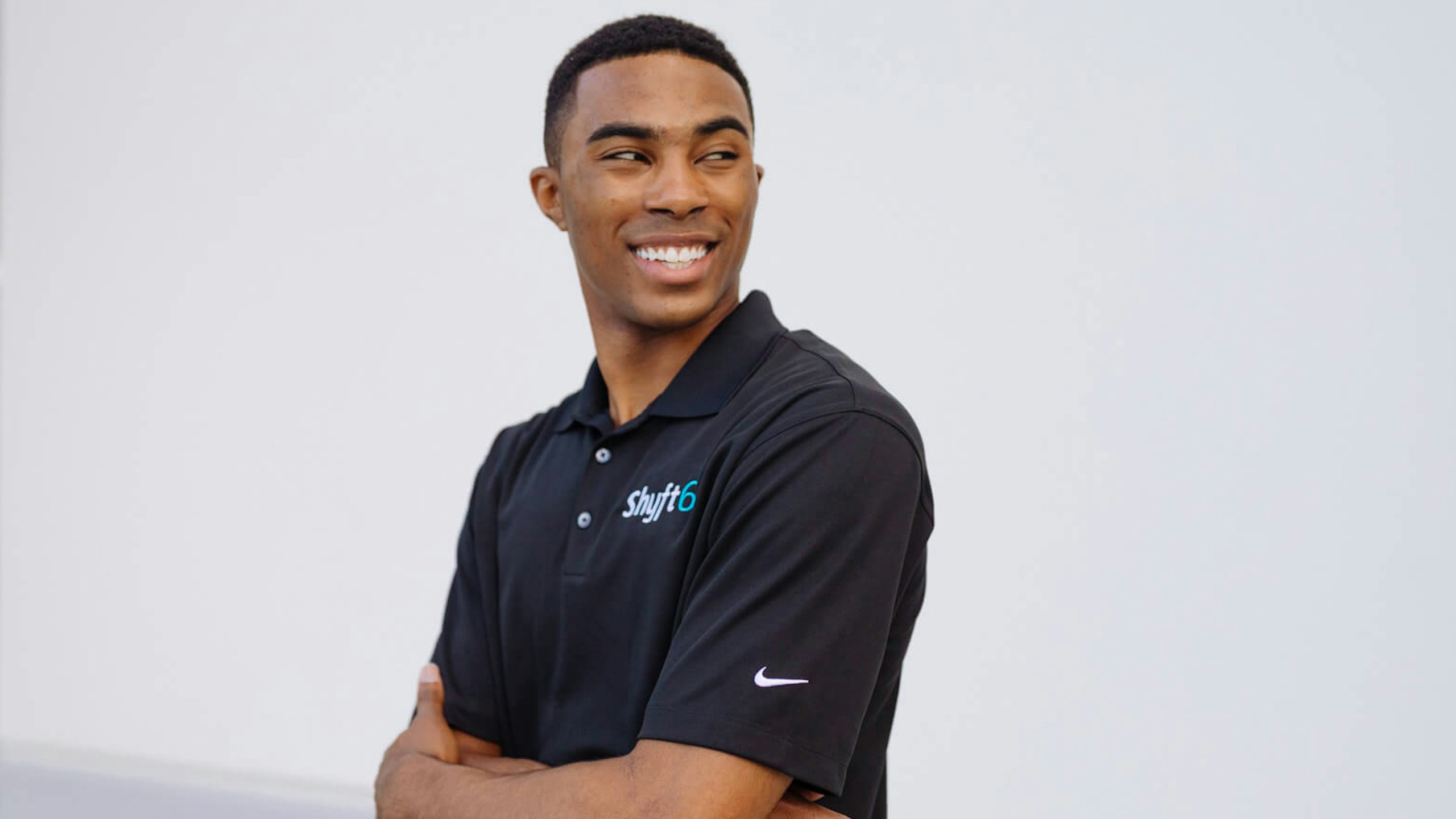 man wearing a black polo