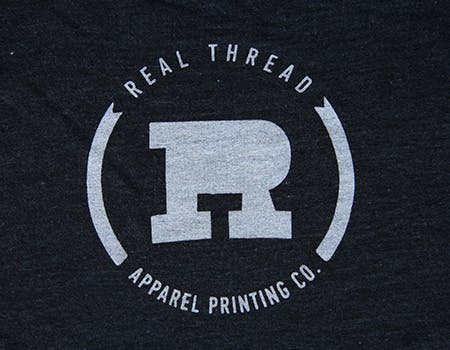 old real thread logo on tri blend black fabric old real thread logo on tri blend black fabric