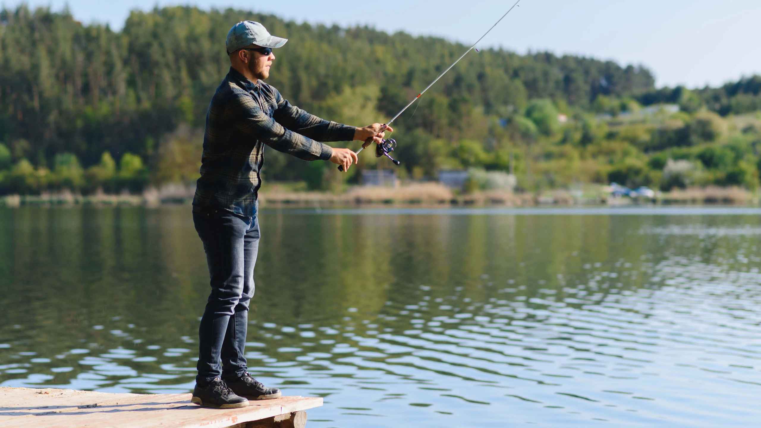 man fishing from a dock