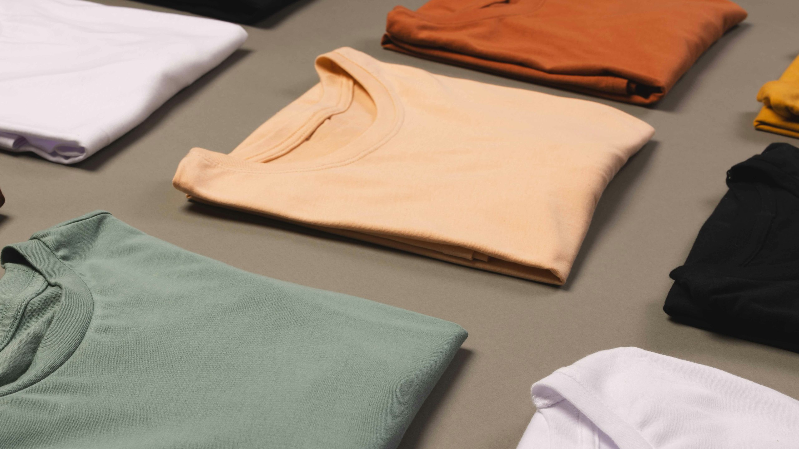 t-shirts folded on a table