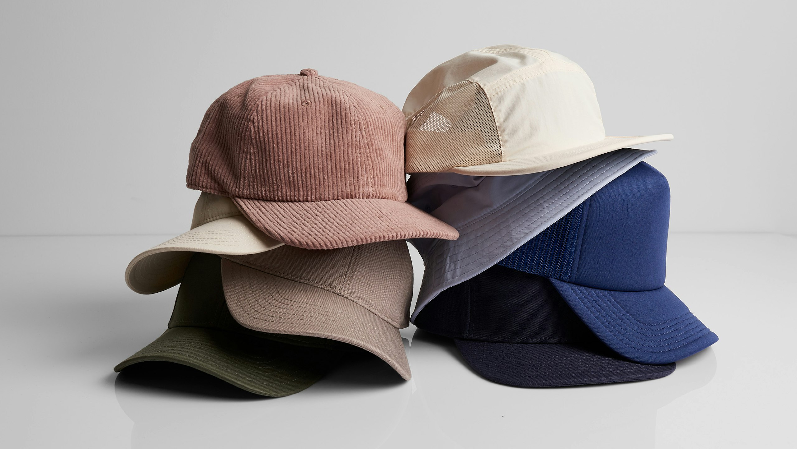 stacks of different hats and colors
