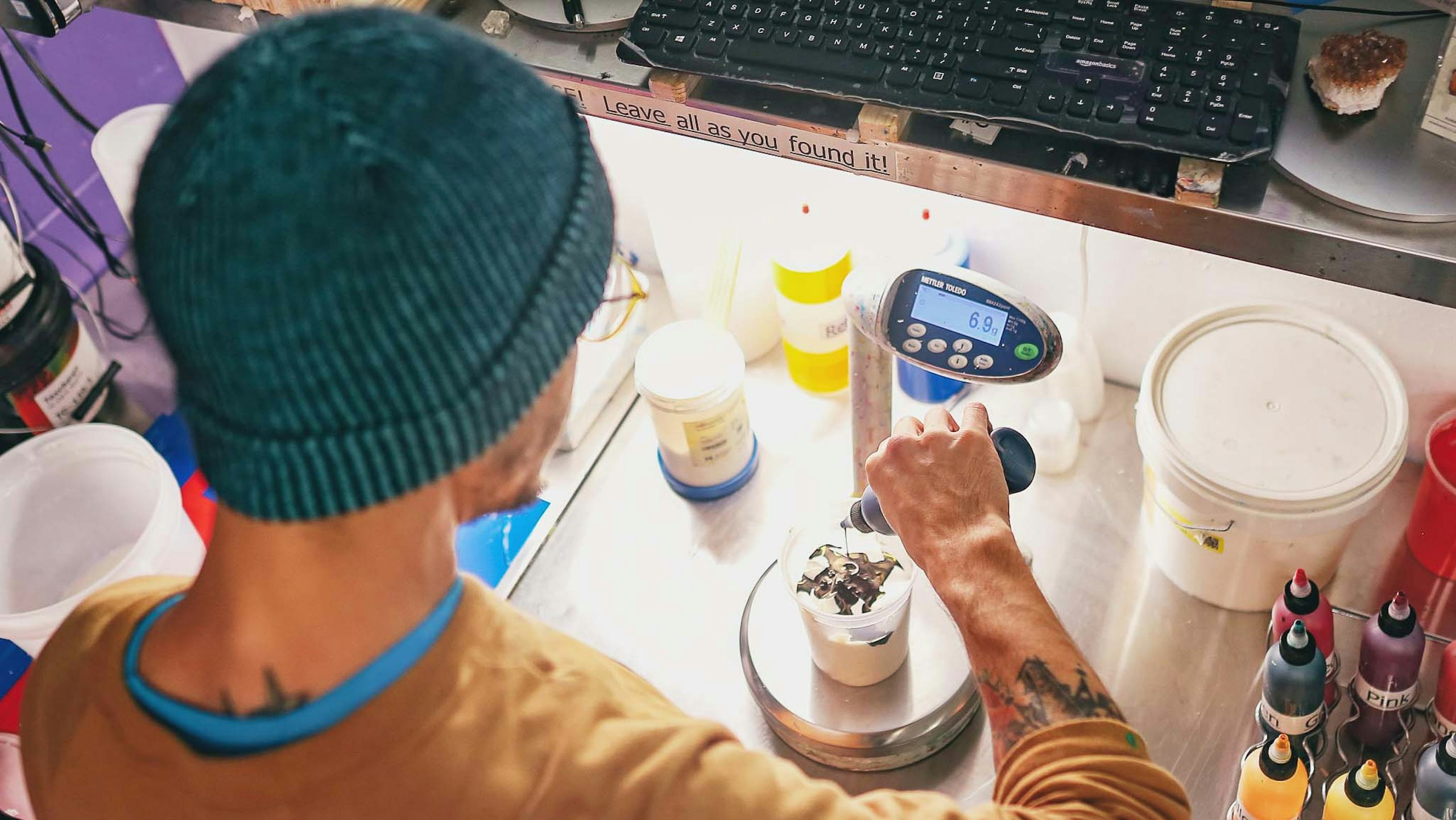 man mixing ink