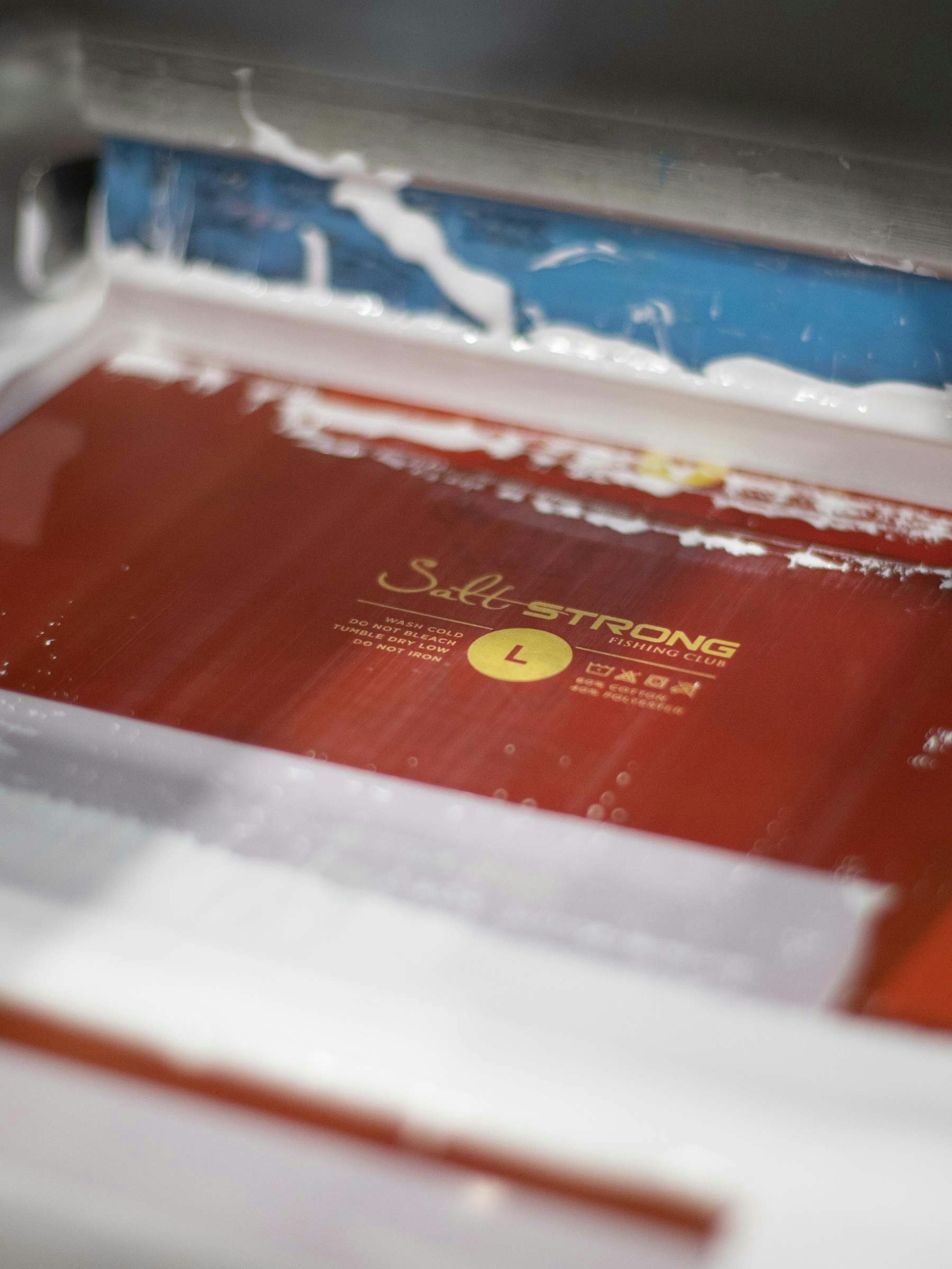 A screen burned with custom printed tag design 