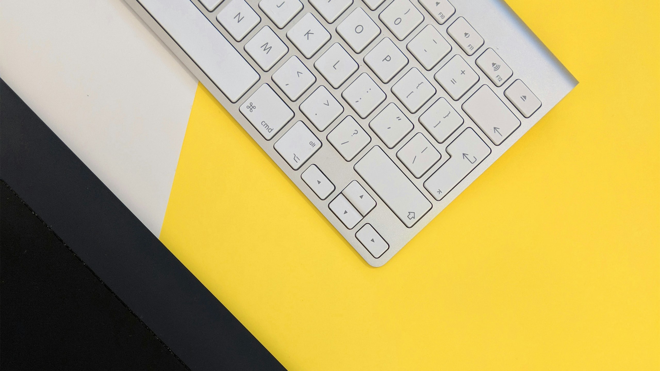 Top-down of a desk that shows a keyboard.