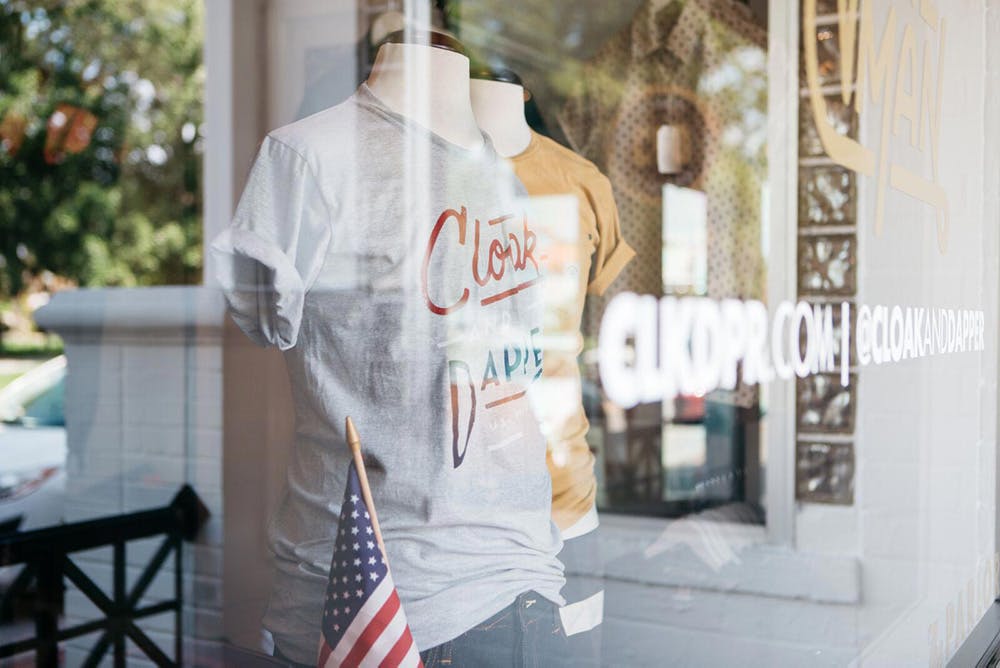 store front with a t-shirt being displayed