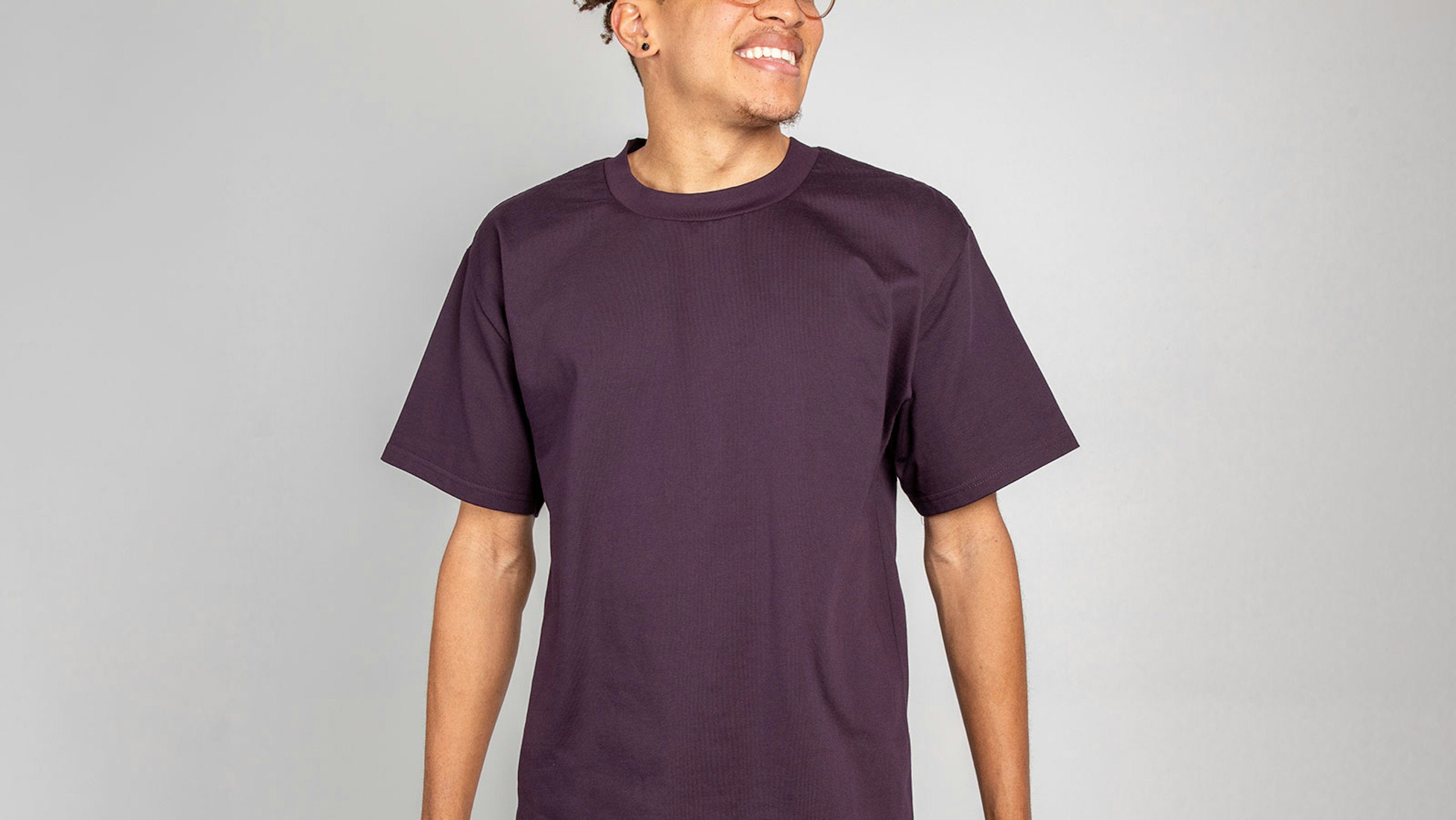 man wearing a plum color t-shirt