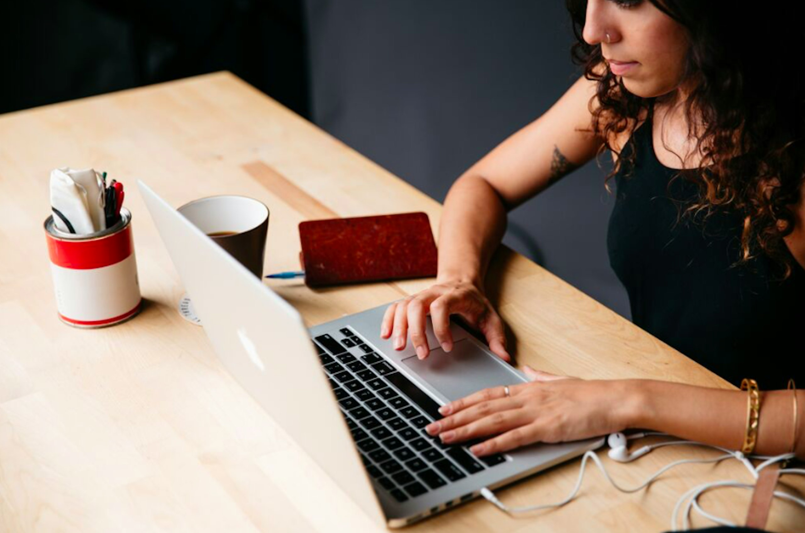 women sitting at a laptop