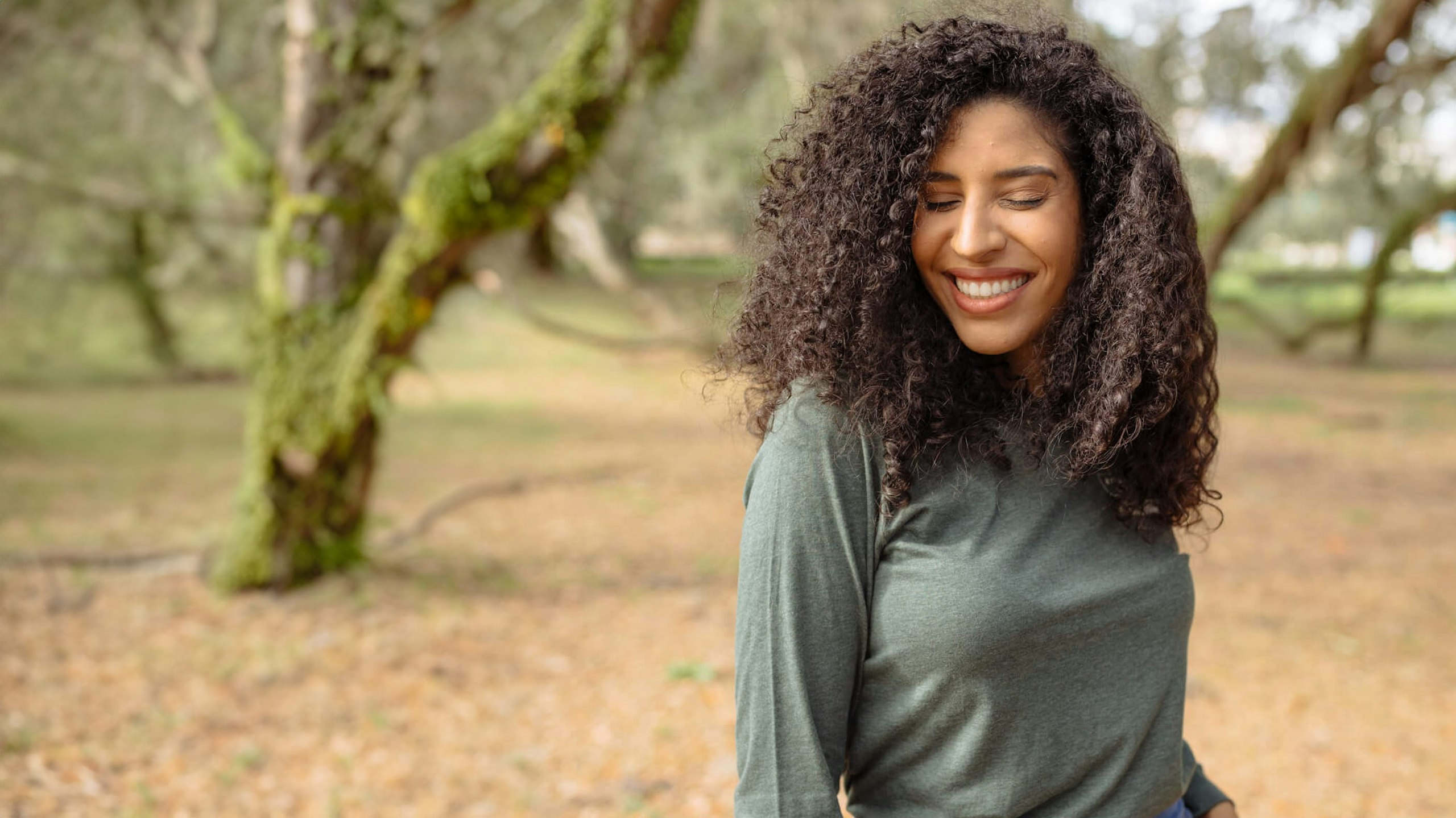 women wearing a long sleeve green shirt