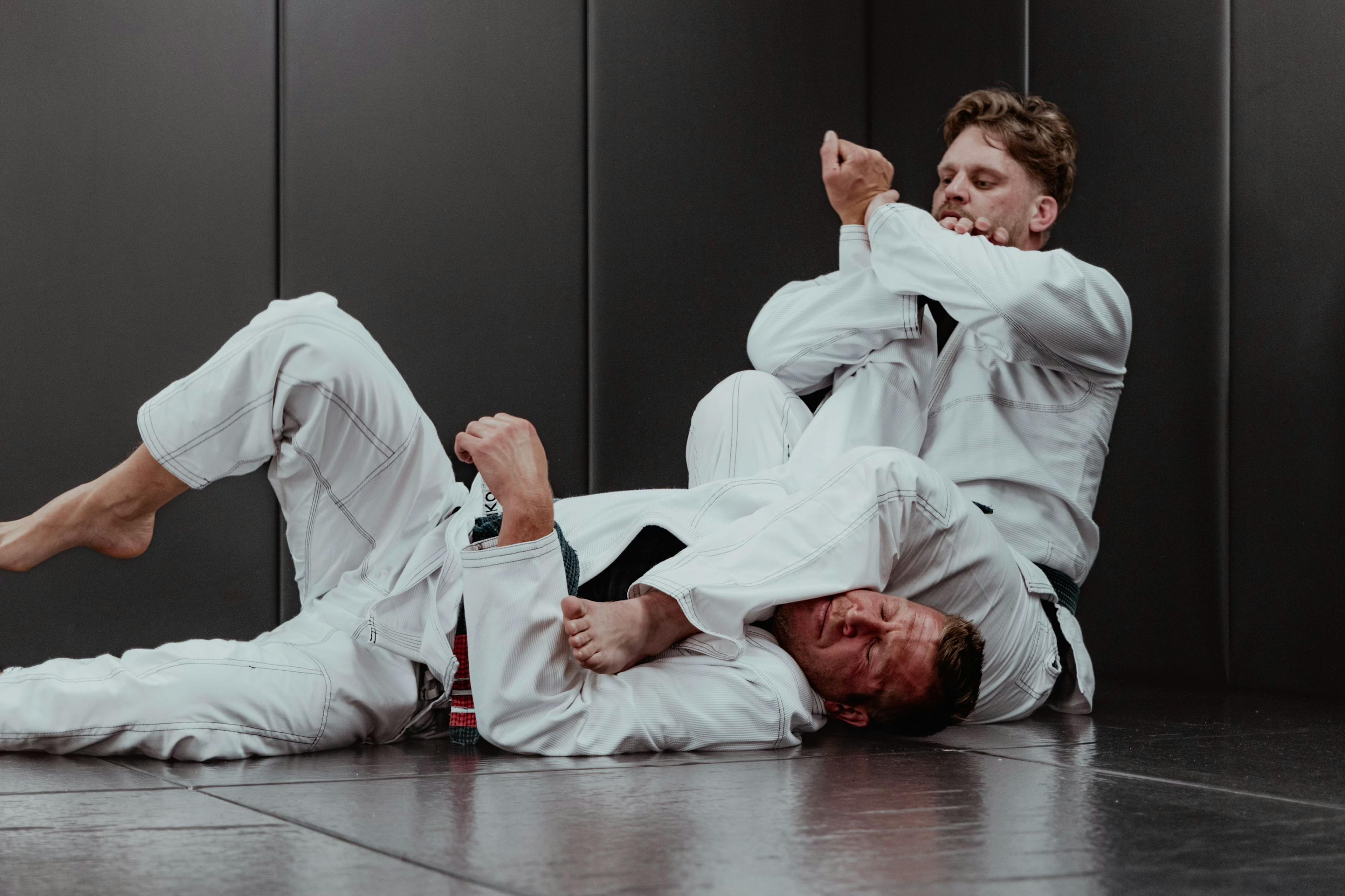 Two Jiu-Jitsu practitioners amidst a training exercise