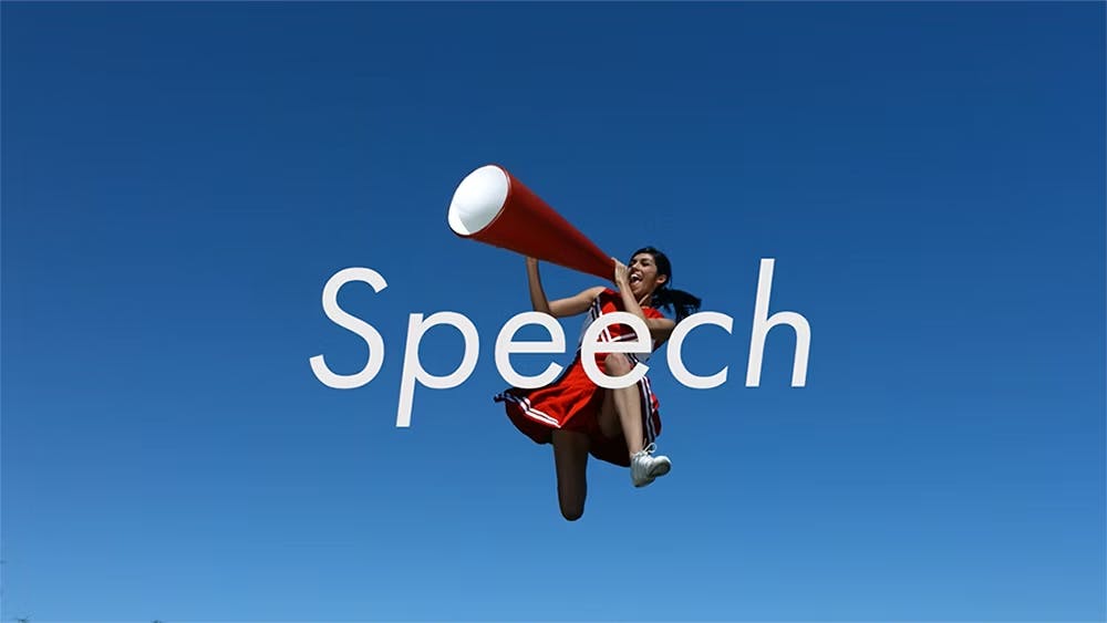 A person in mid-air wearing a red cheerleader dress and holding a large megaphone with the word "Speech" overlaid on top