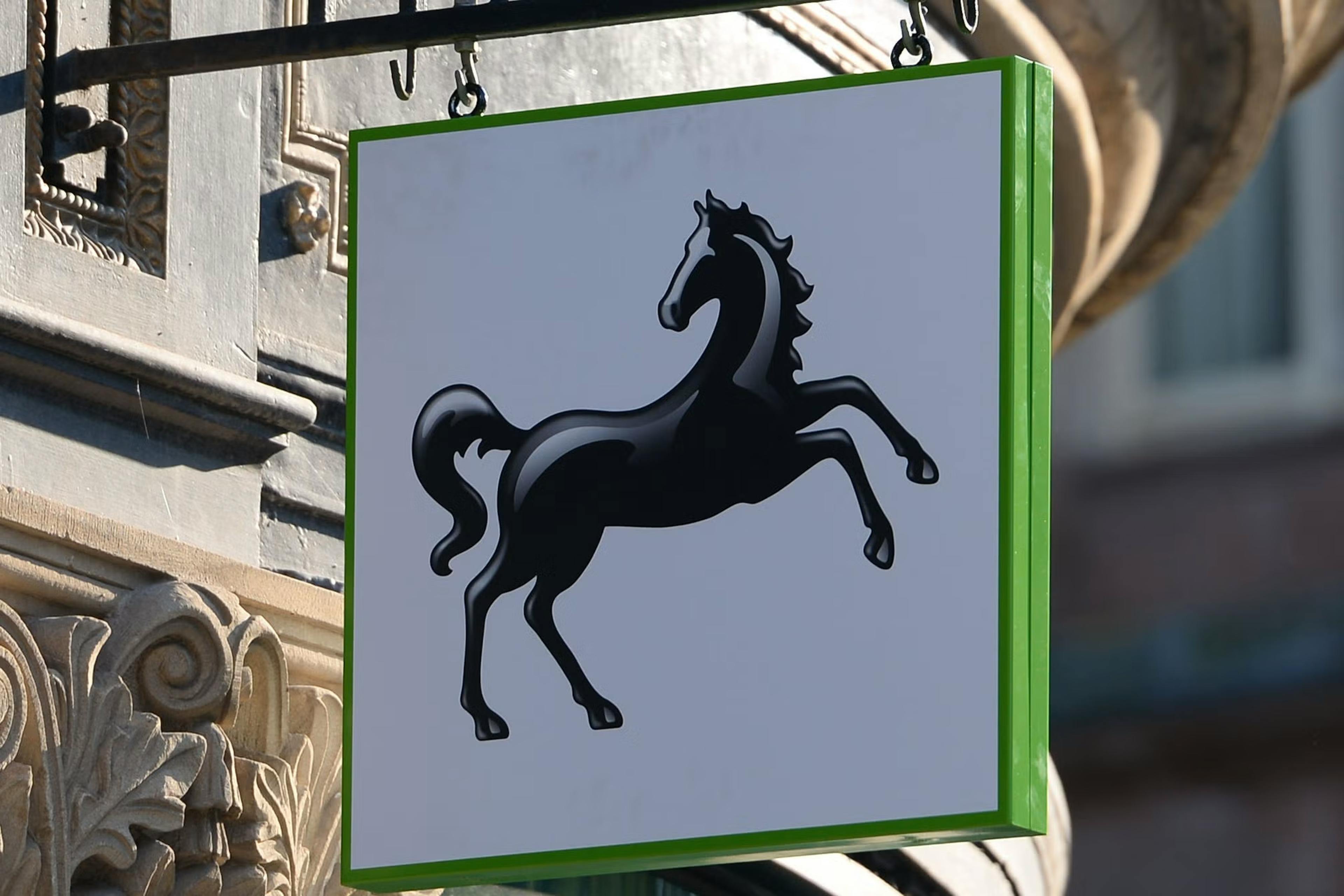 a sign with black horse finance logo