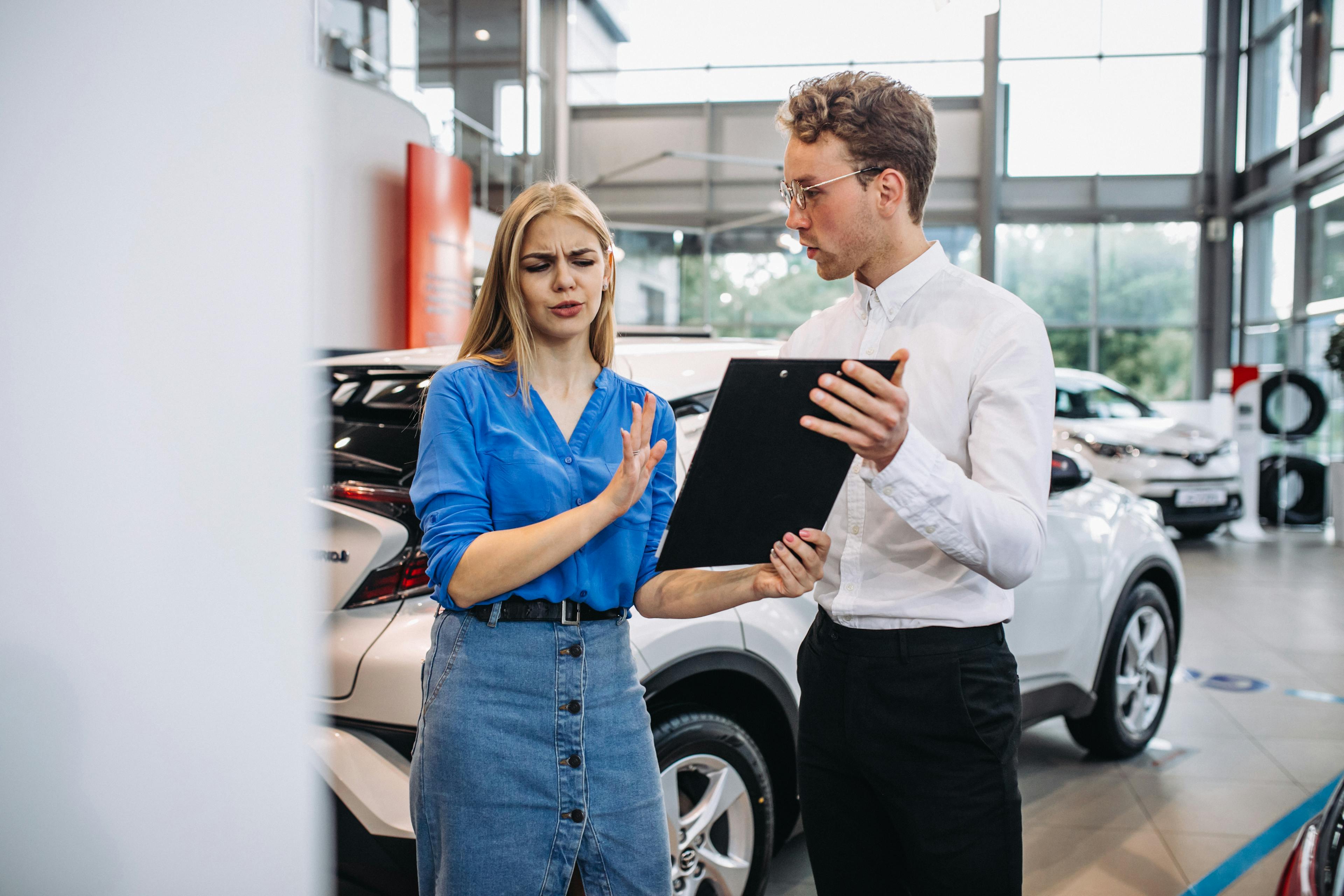 Confused woman rejecting car finance offer