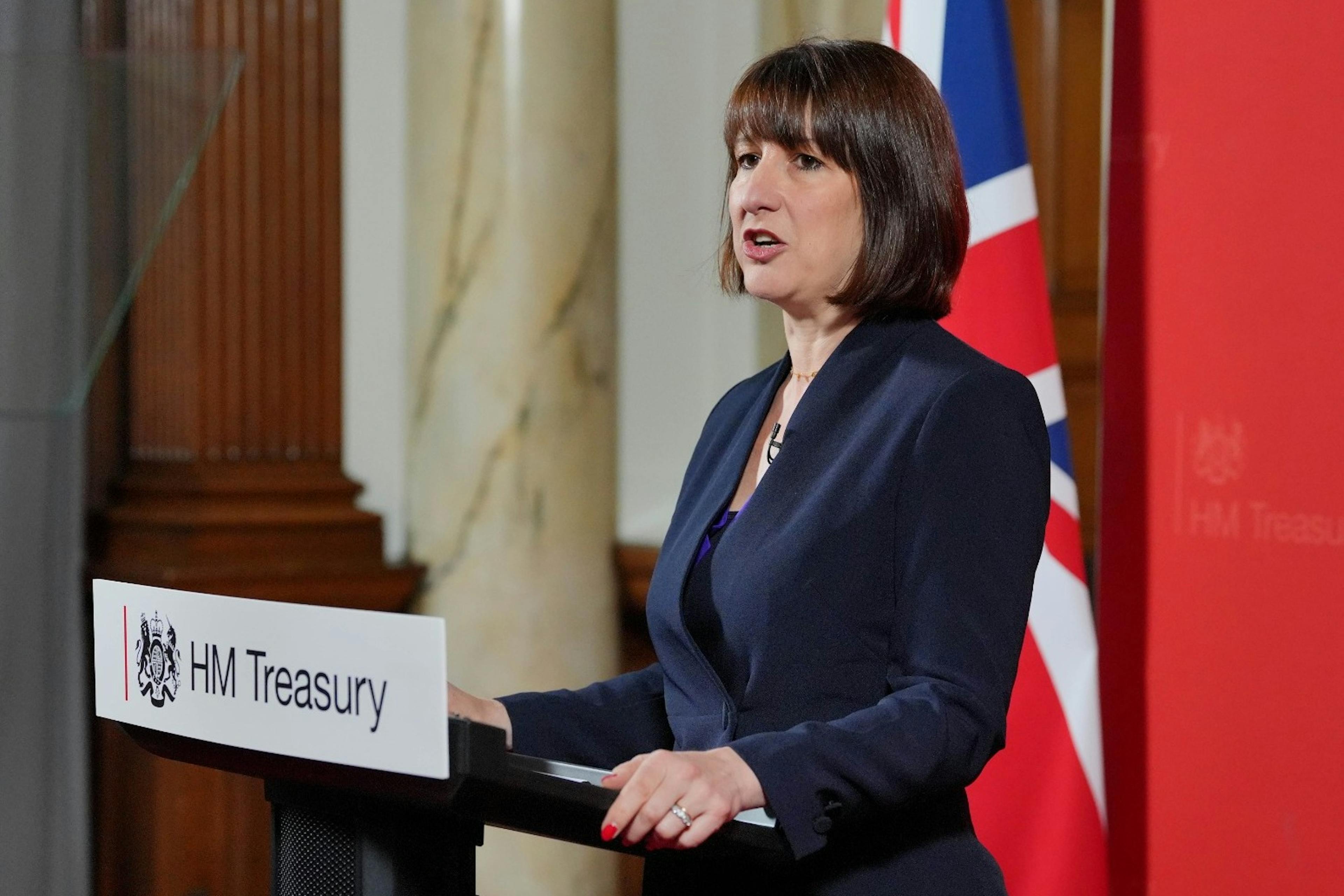 Chancellor Rachel Reeves speaking on a podium