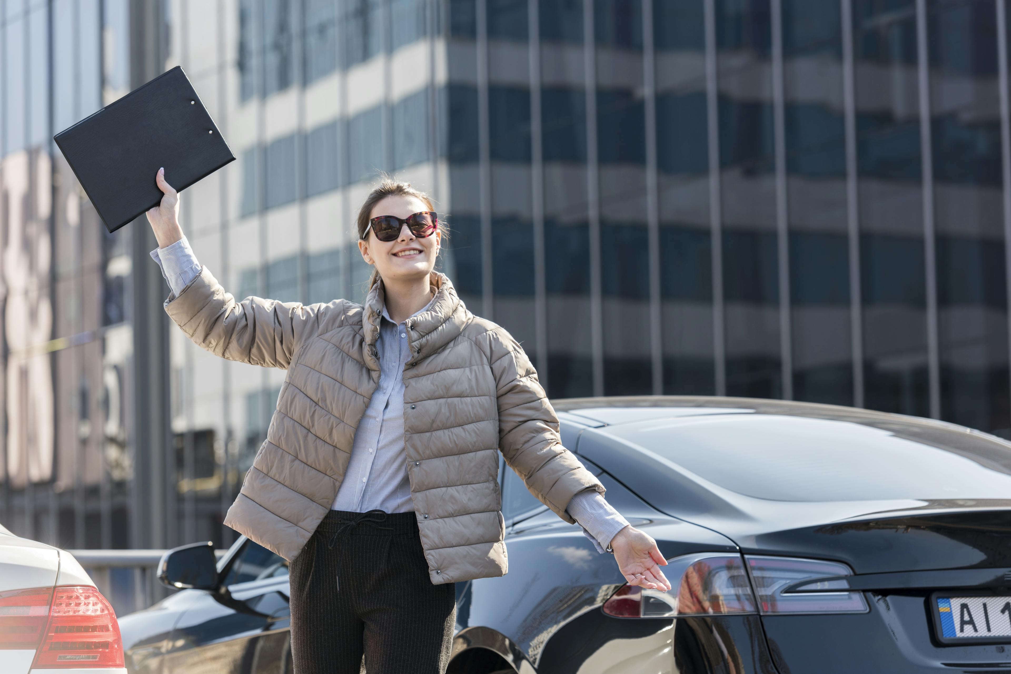 Happy woman celebrating successful car finance claim