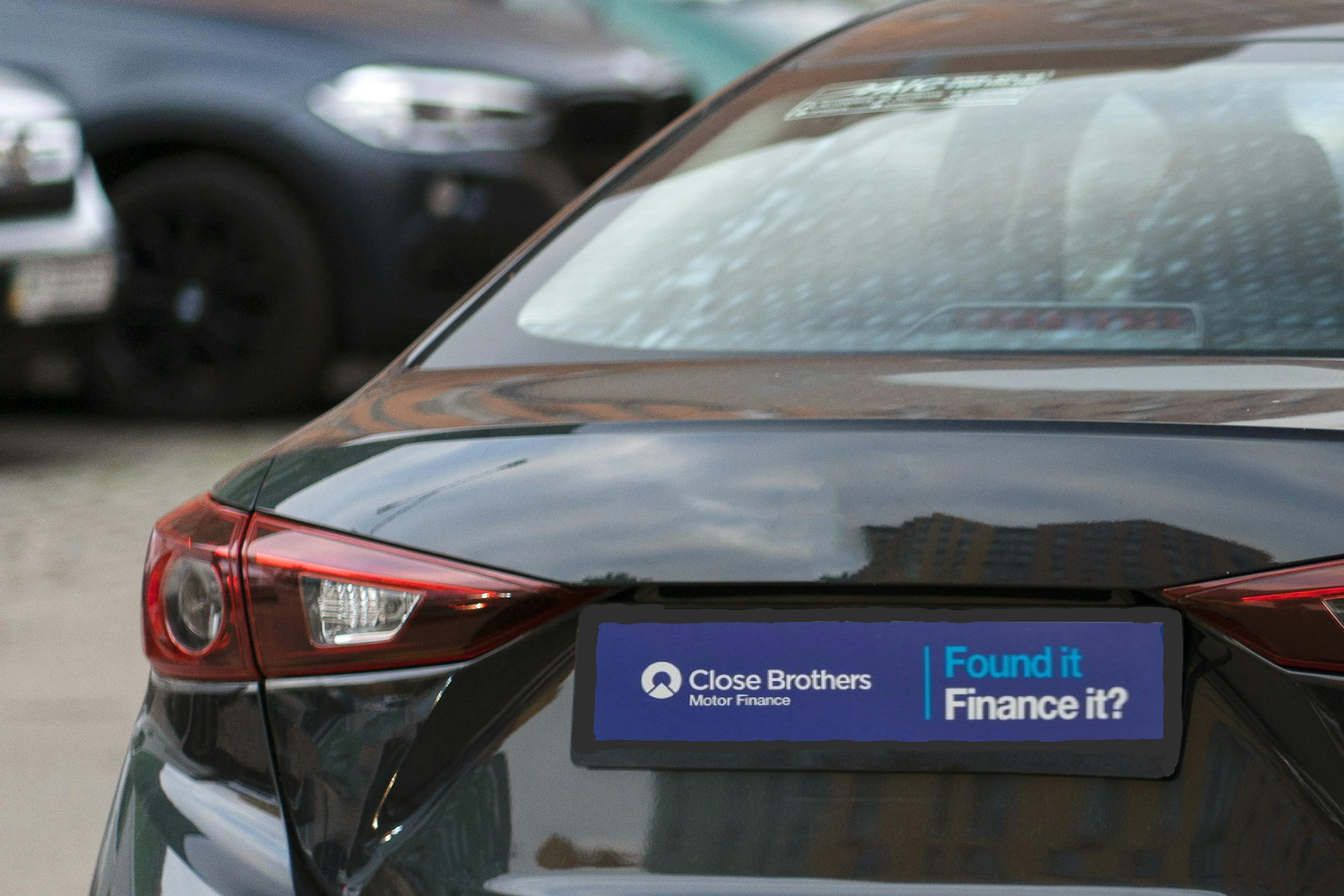 Close Brothers car finance advertisement on parked vehicle