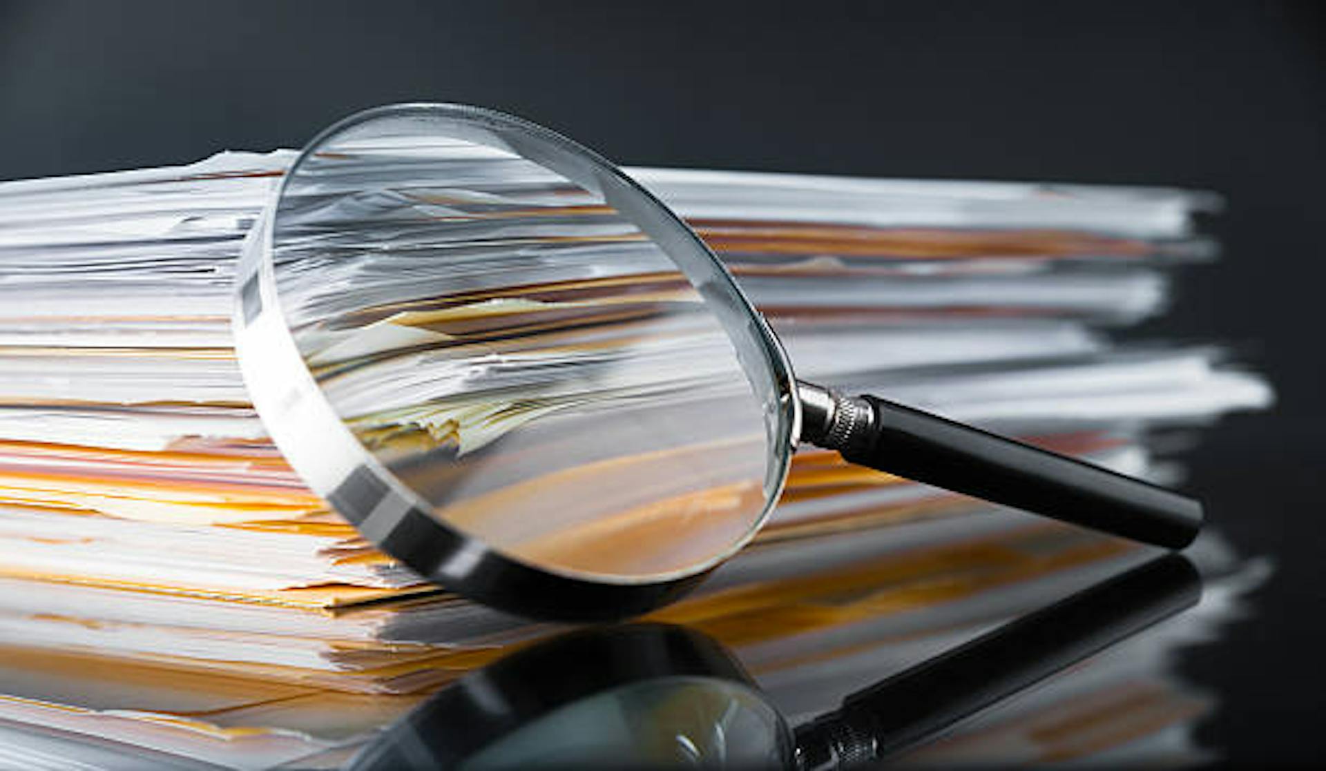 magnifying glass over documents