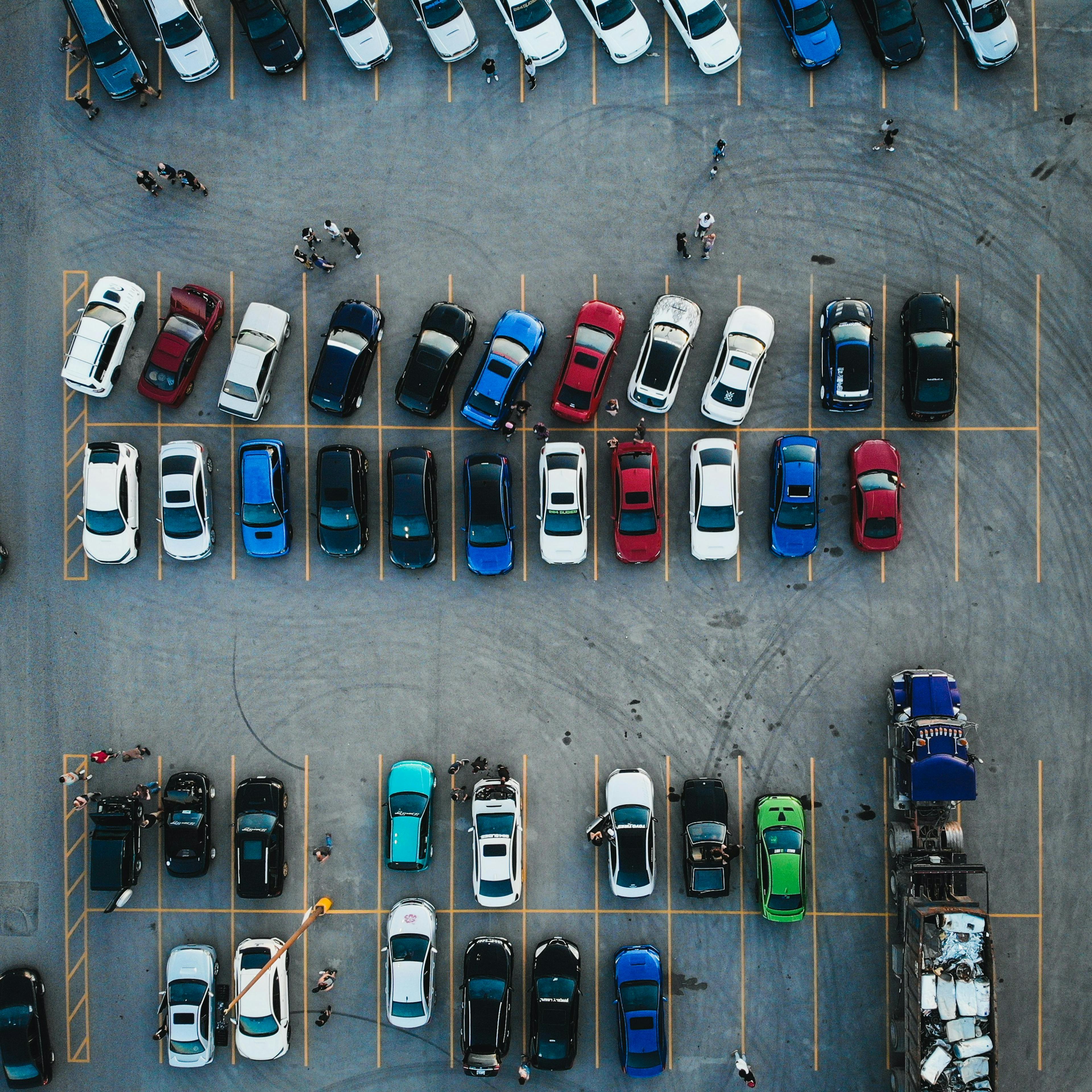 cars in a parking lot aerial shot