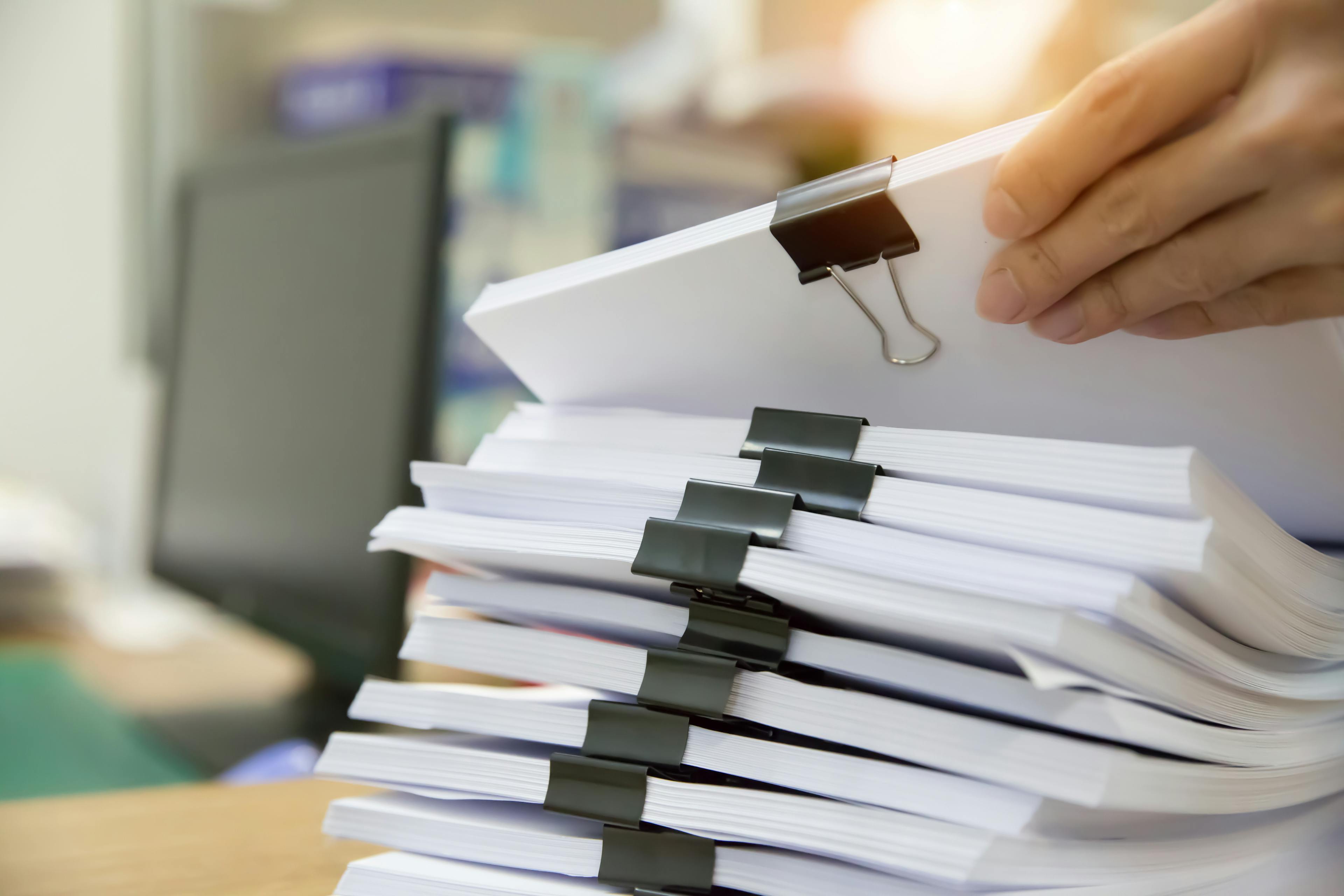 Hand sorting large stacks of paper documents