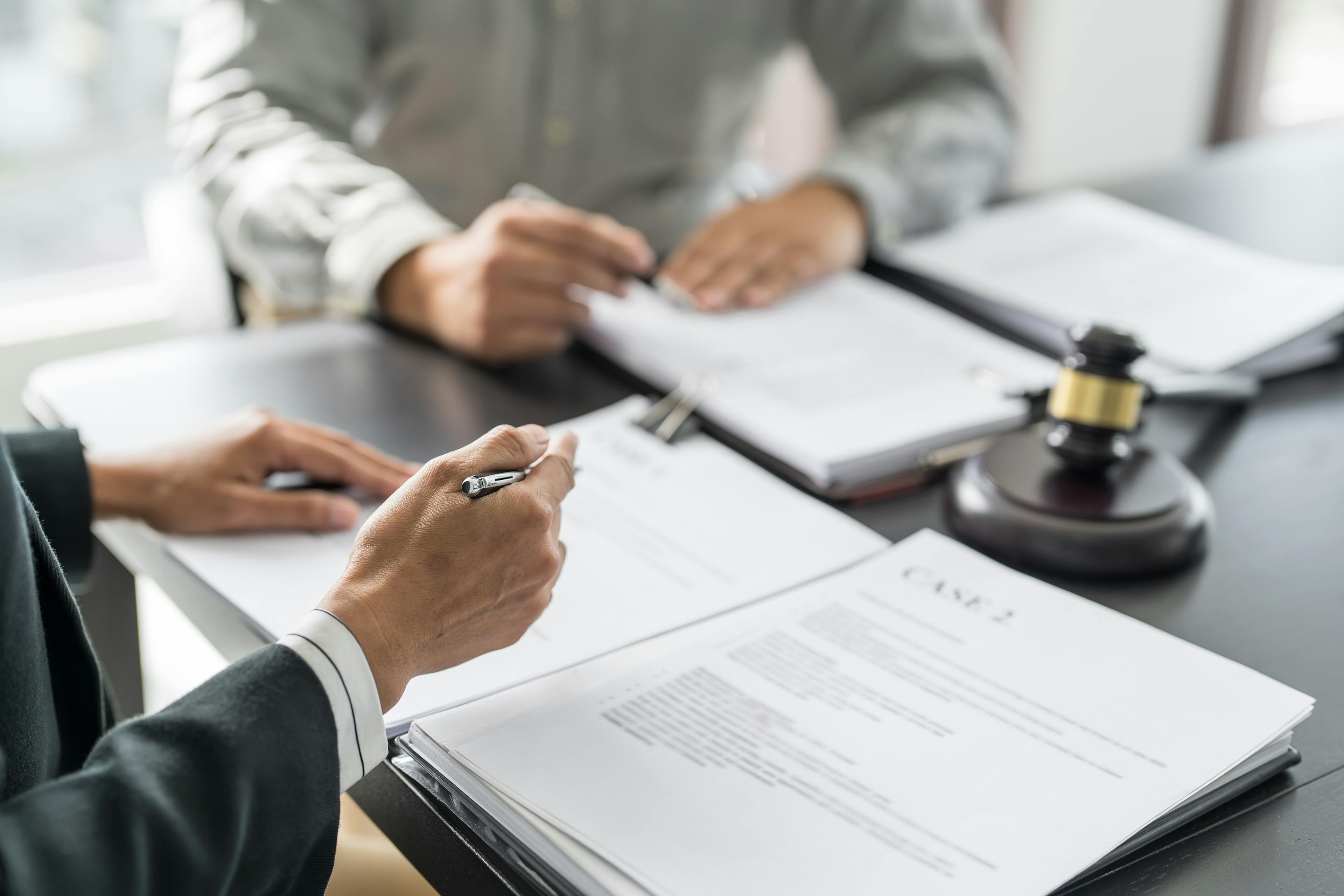 Lawyers reviewing legal case documents together