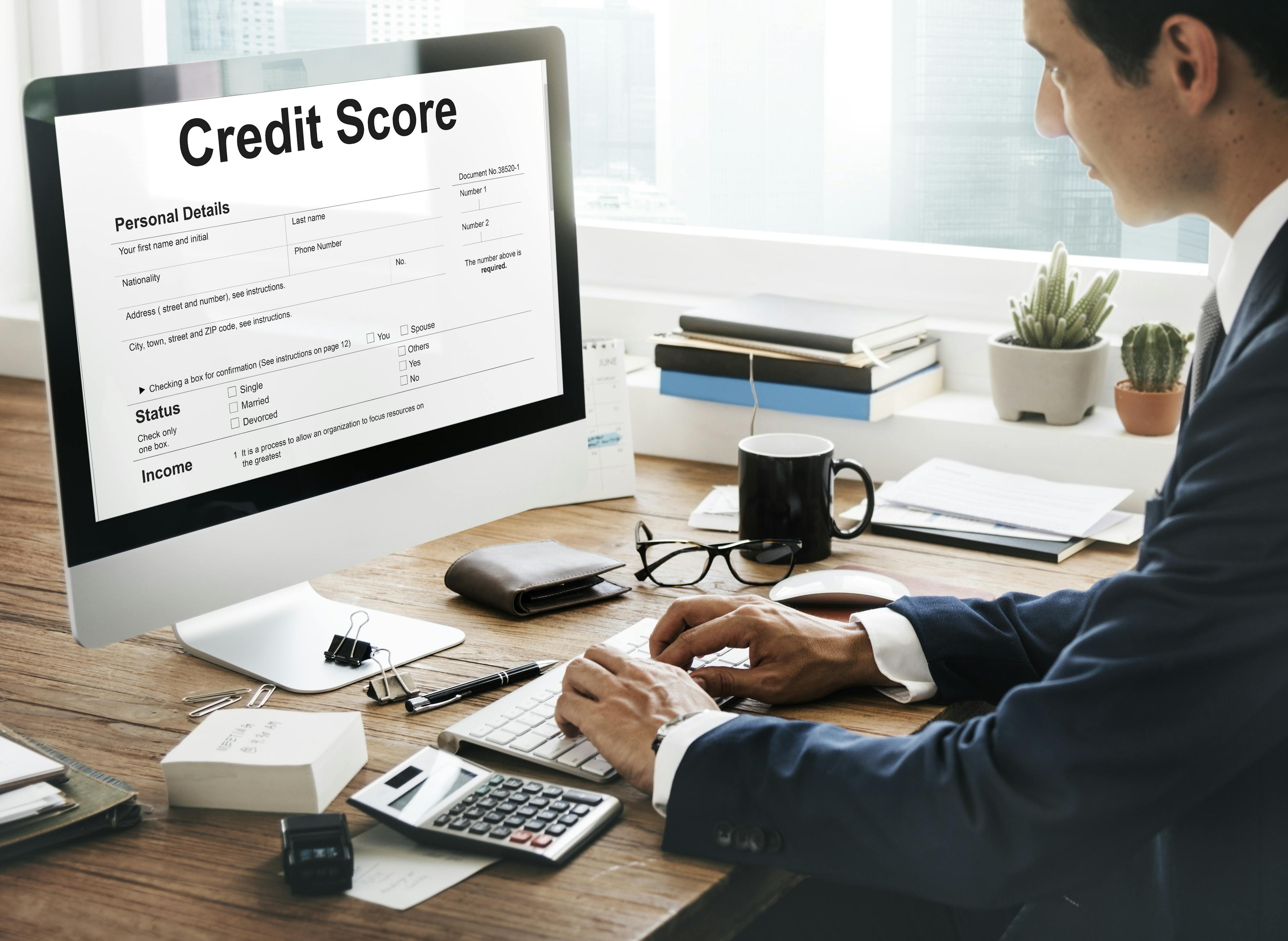 man checking his credit score on a computer