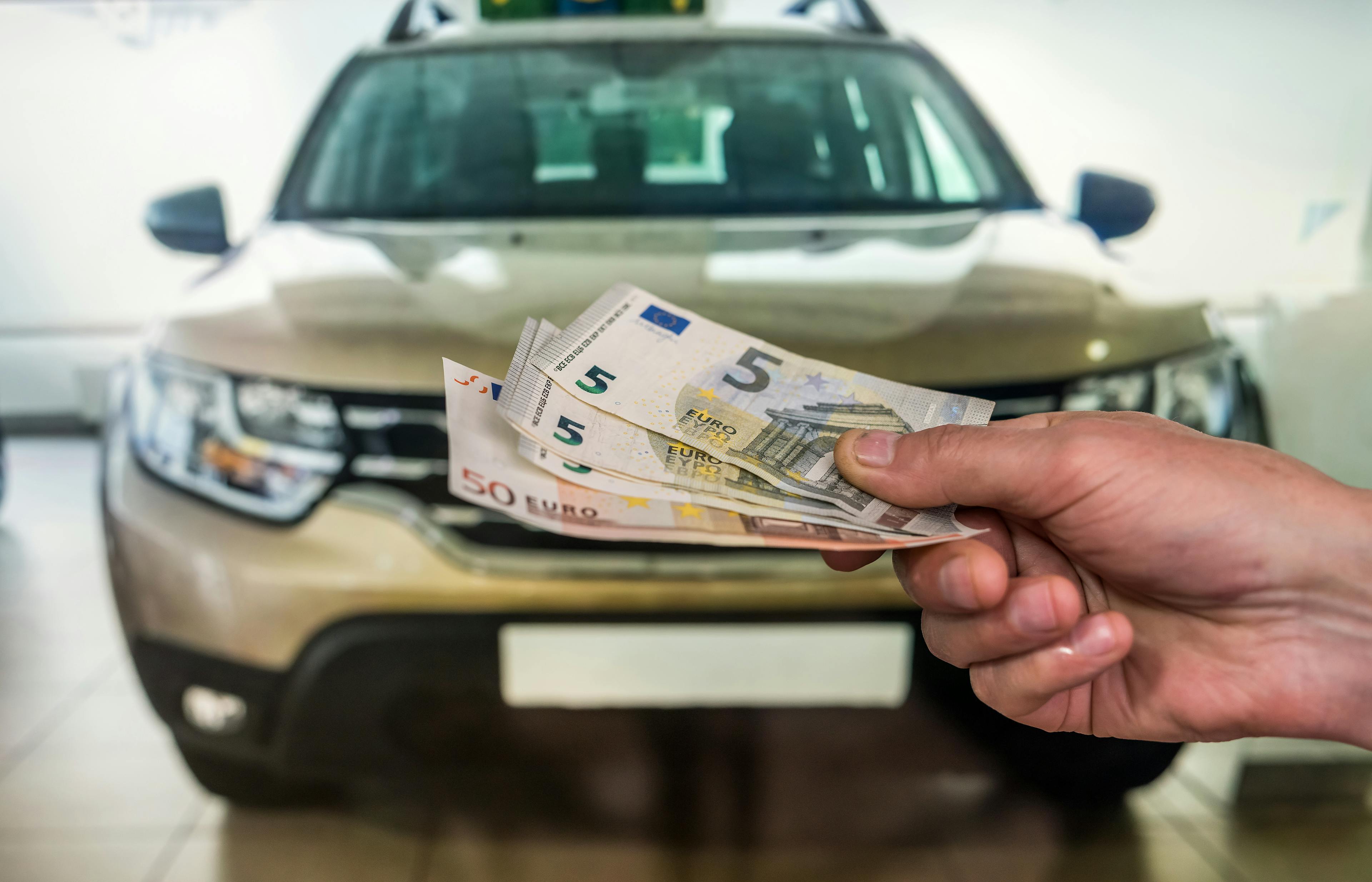 man buying a car from a dealership