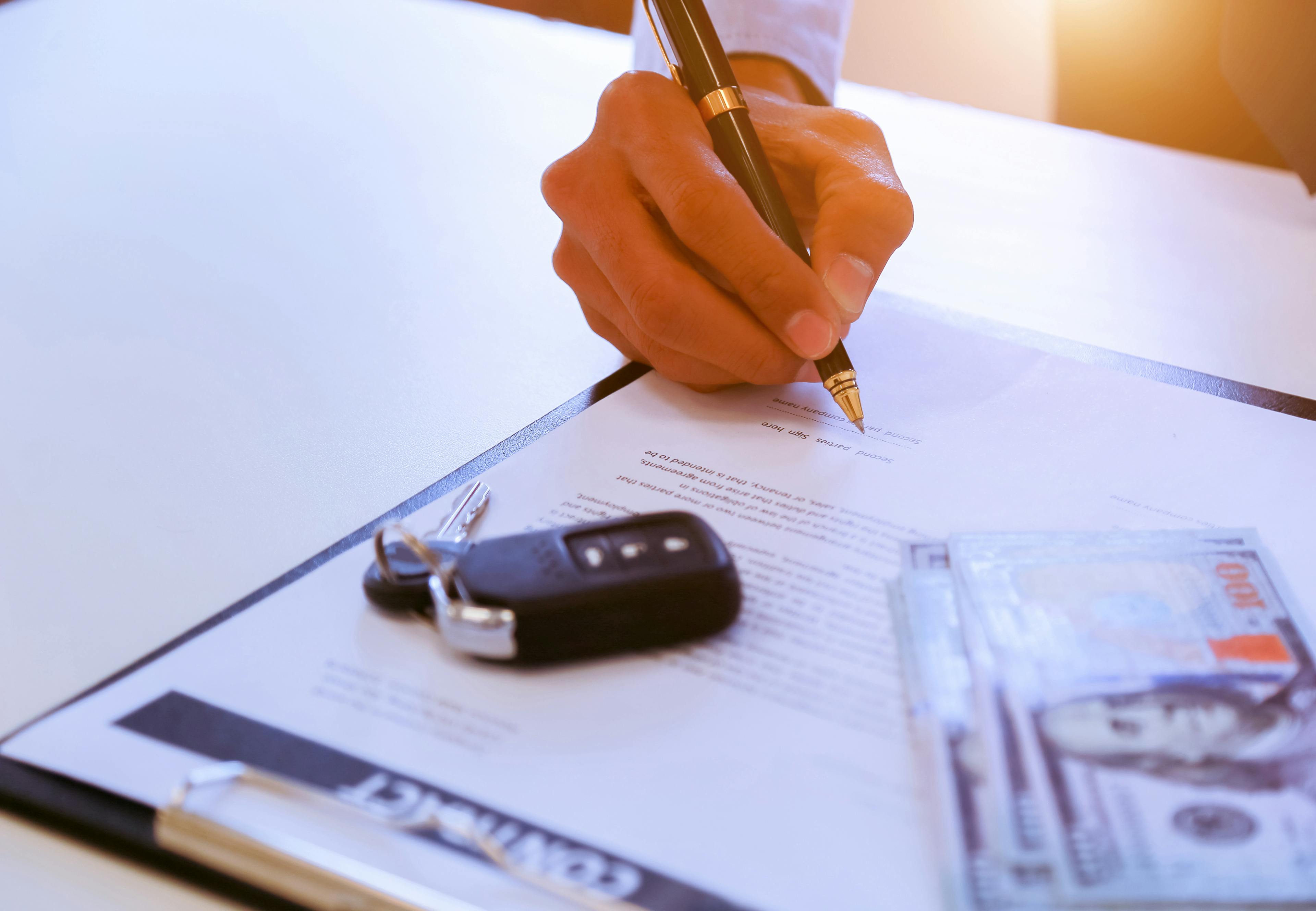 person signing a contract