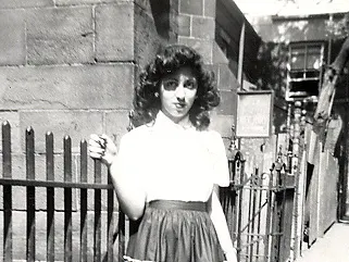 Gloria by fence, 1950s.
