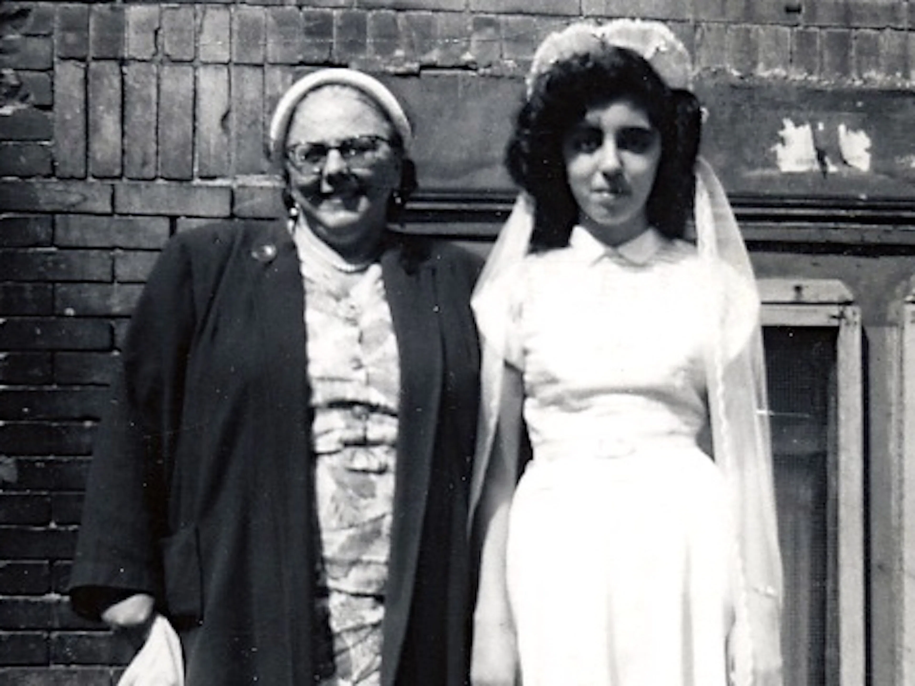 Gloria and her godmother, 1950s.