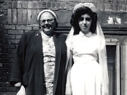 Gloria and her godmother, 1950s.