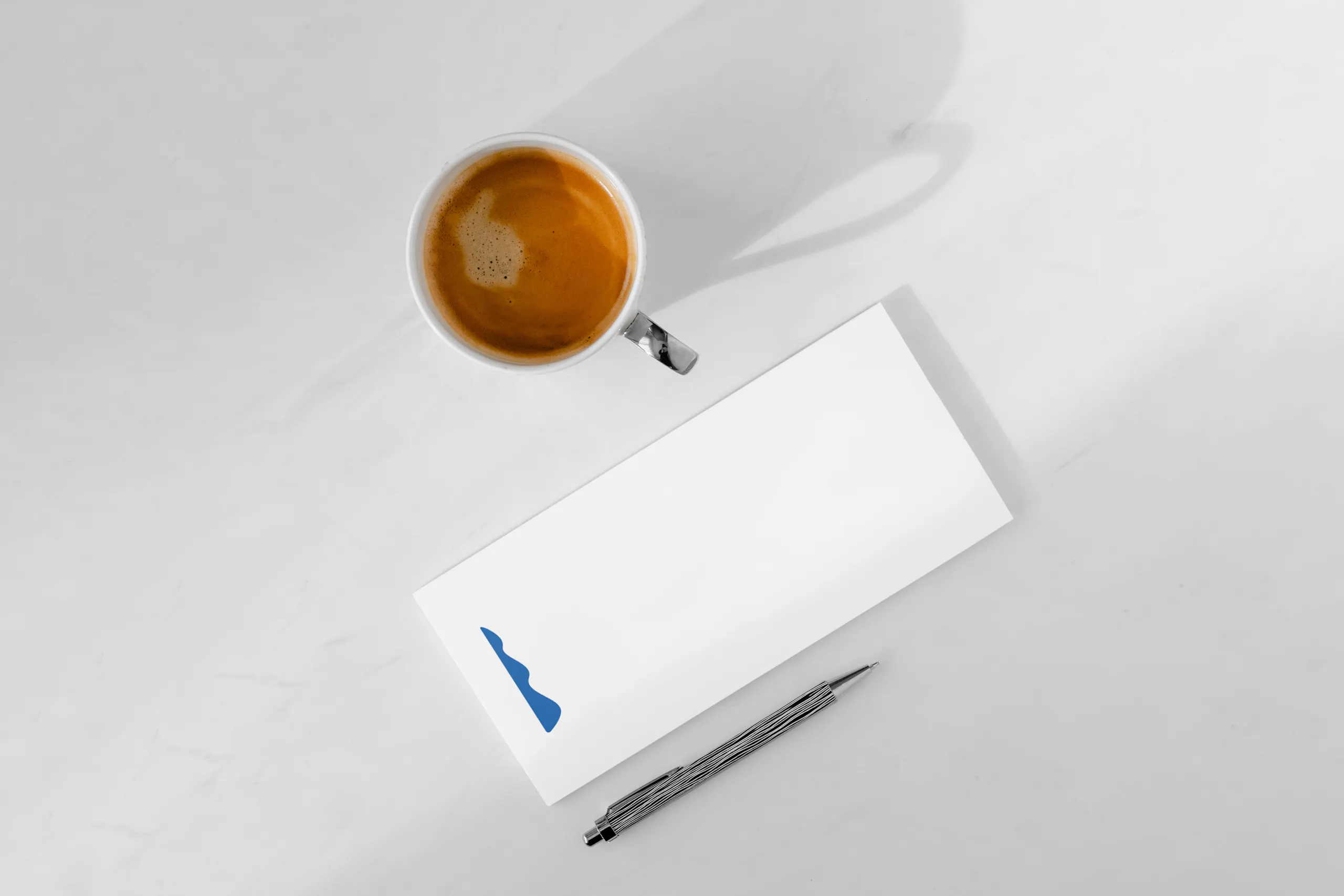coffee and branded notepad