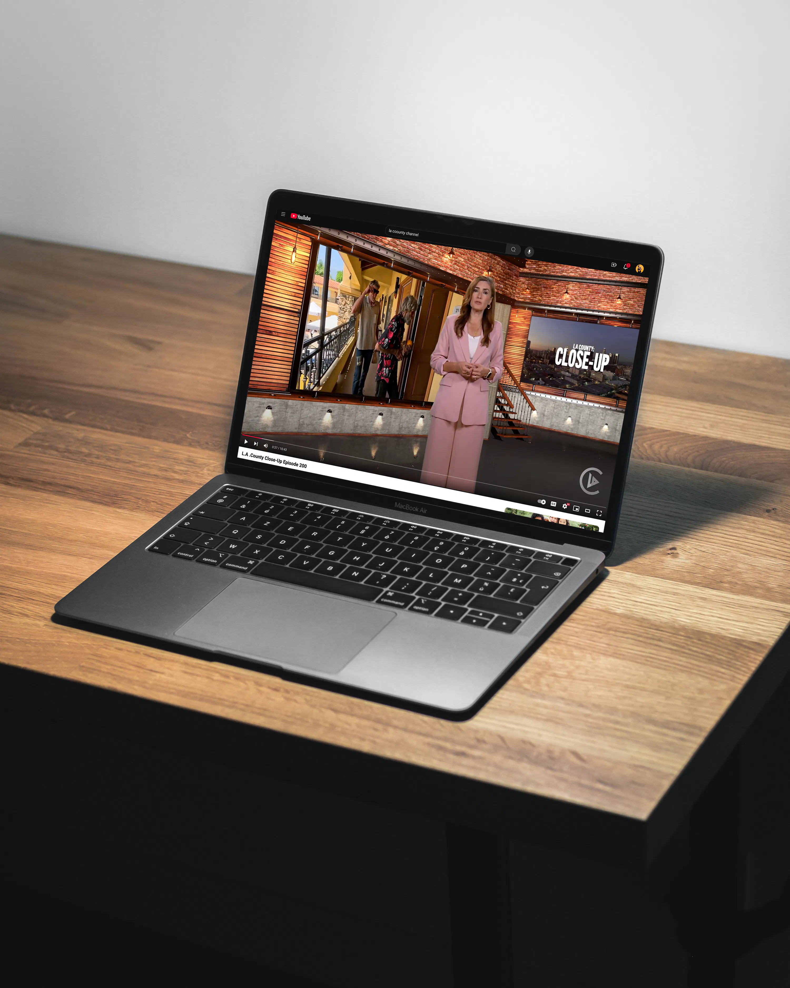 newscaster on macbook