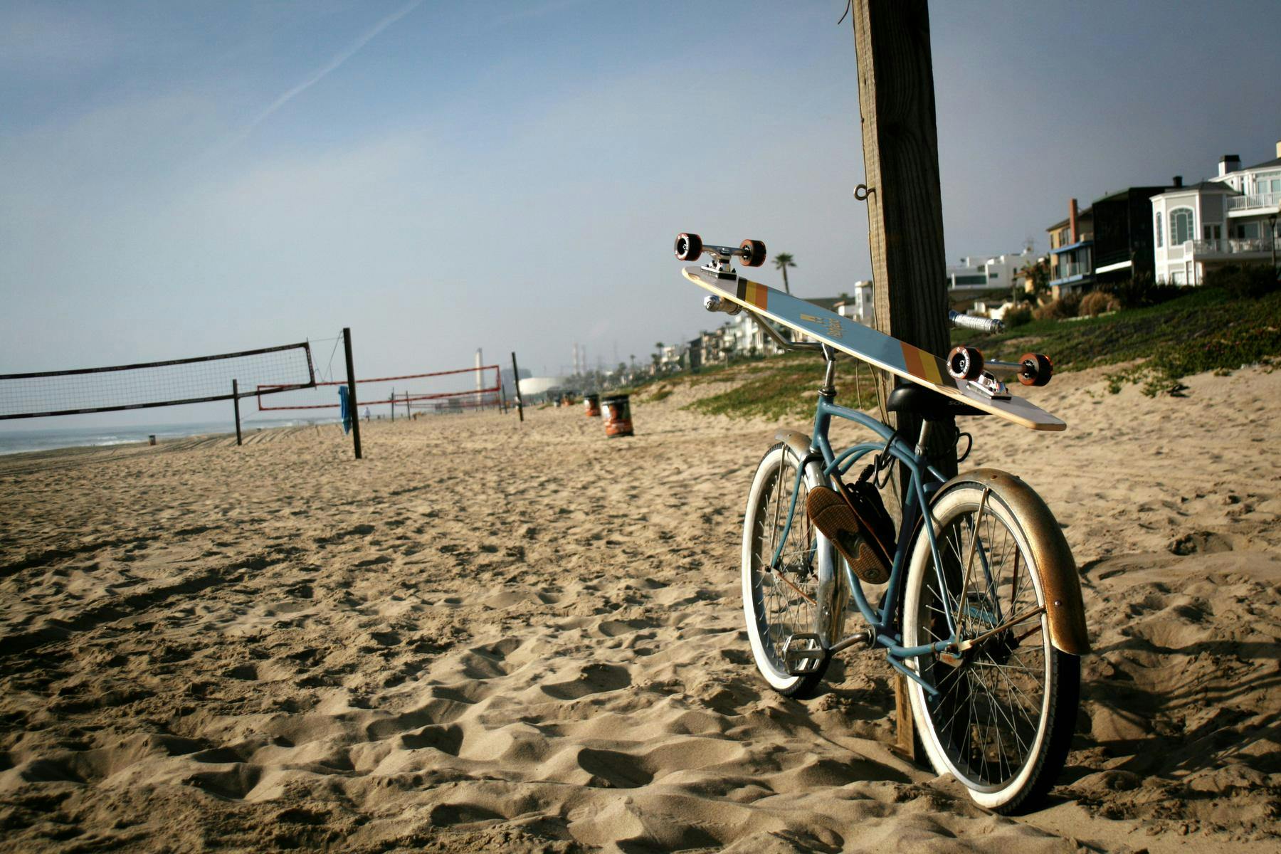 skateboard on top of a bike on a beach
