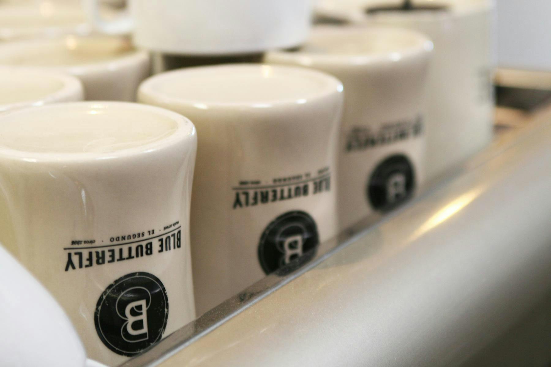 upside down branded blue butterfly mugs