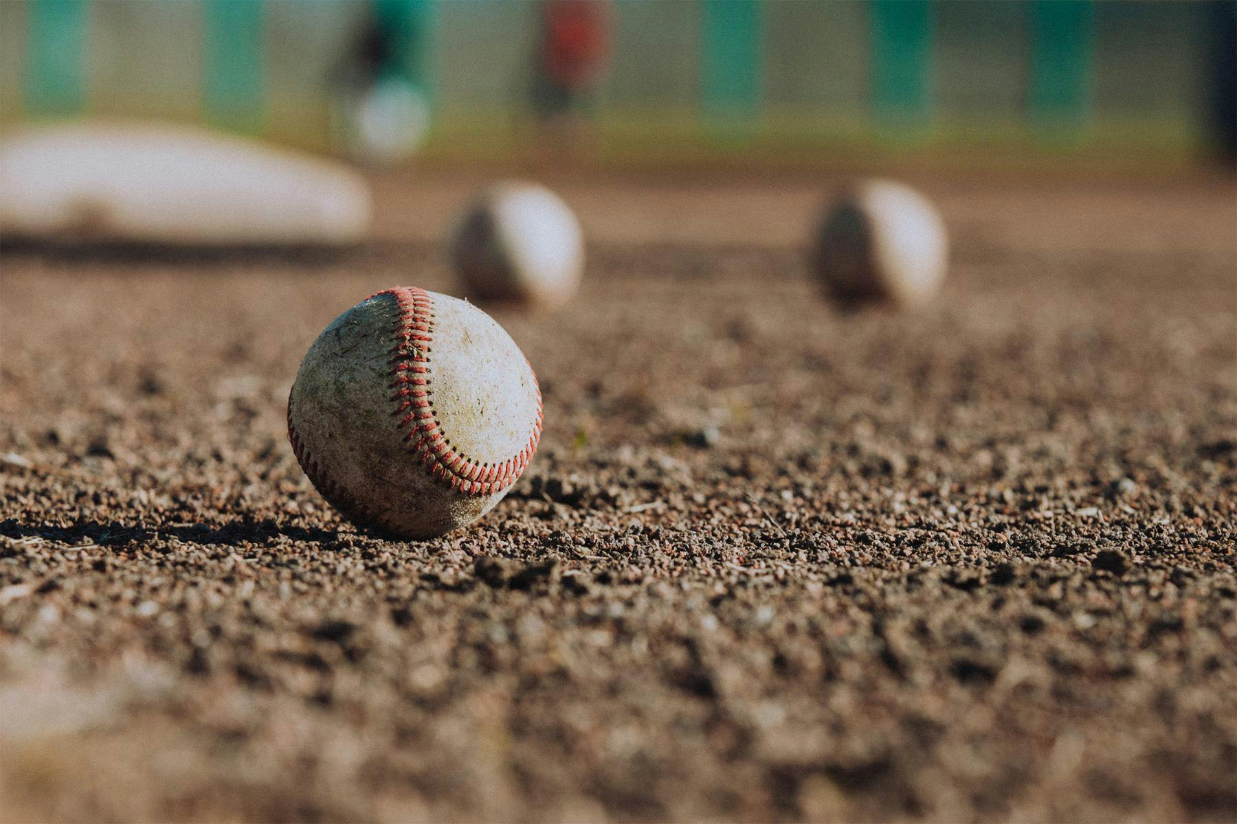 baseballs on dirt