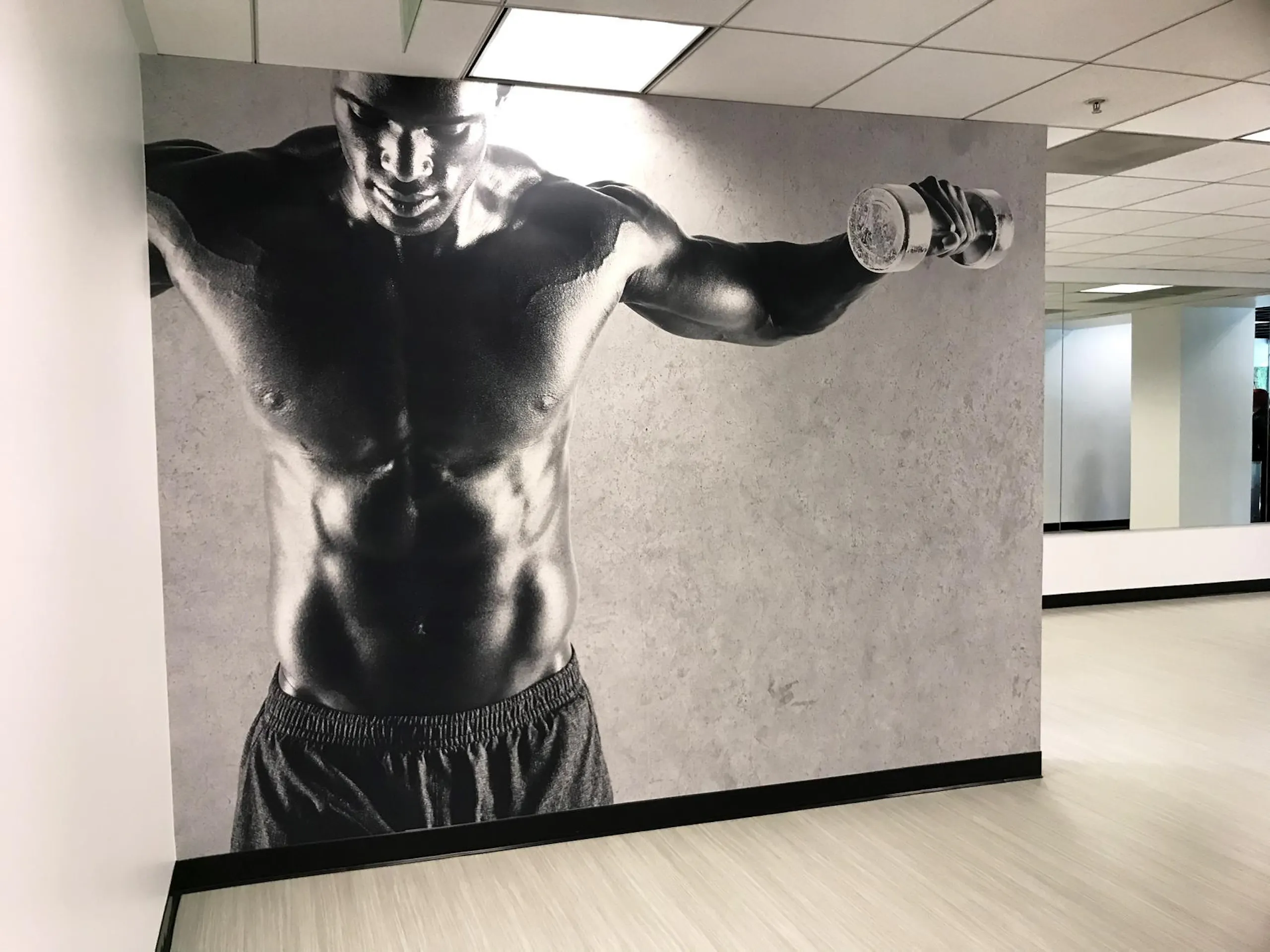 male bodybuilder poster on wall in gym