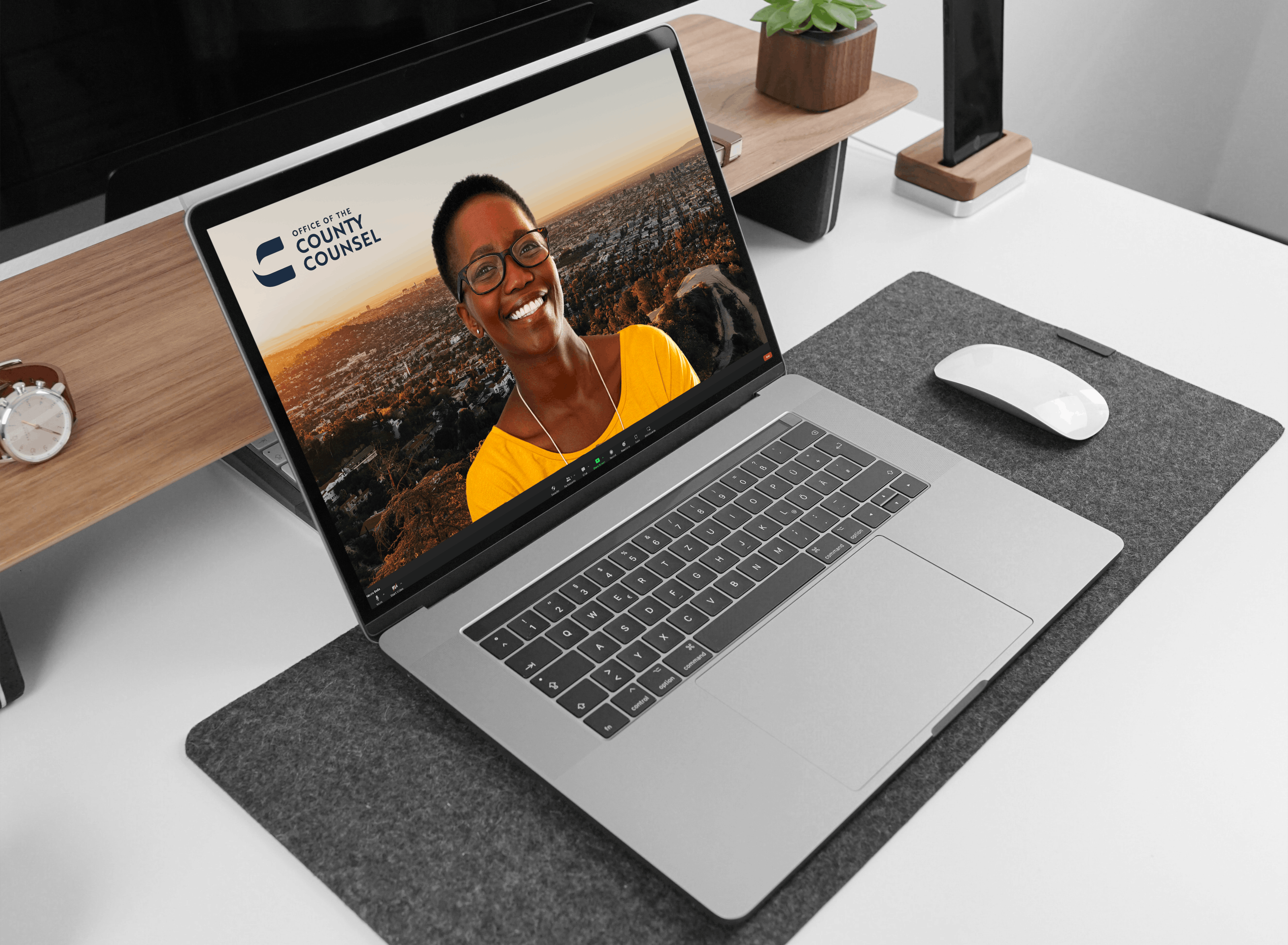 macbook with smiling person brand in the corner
