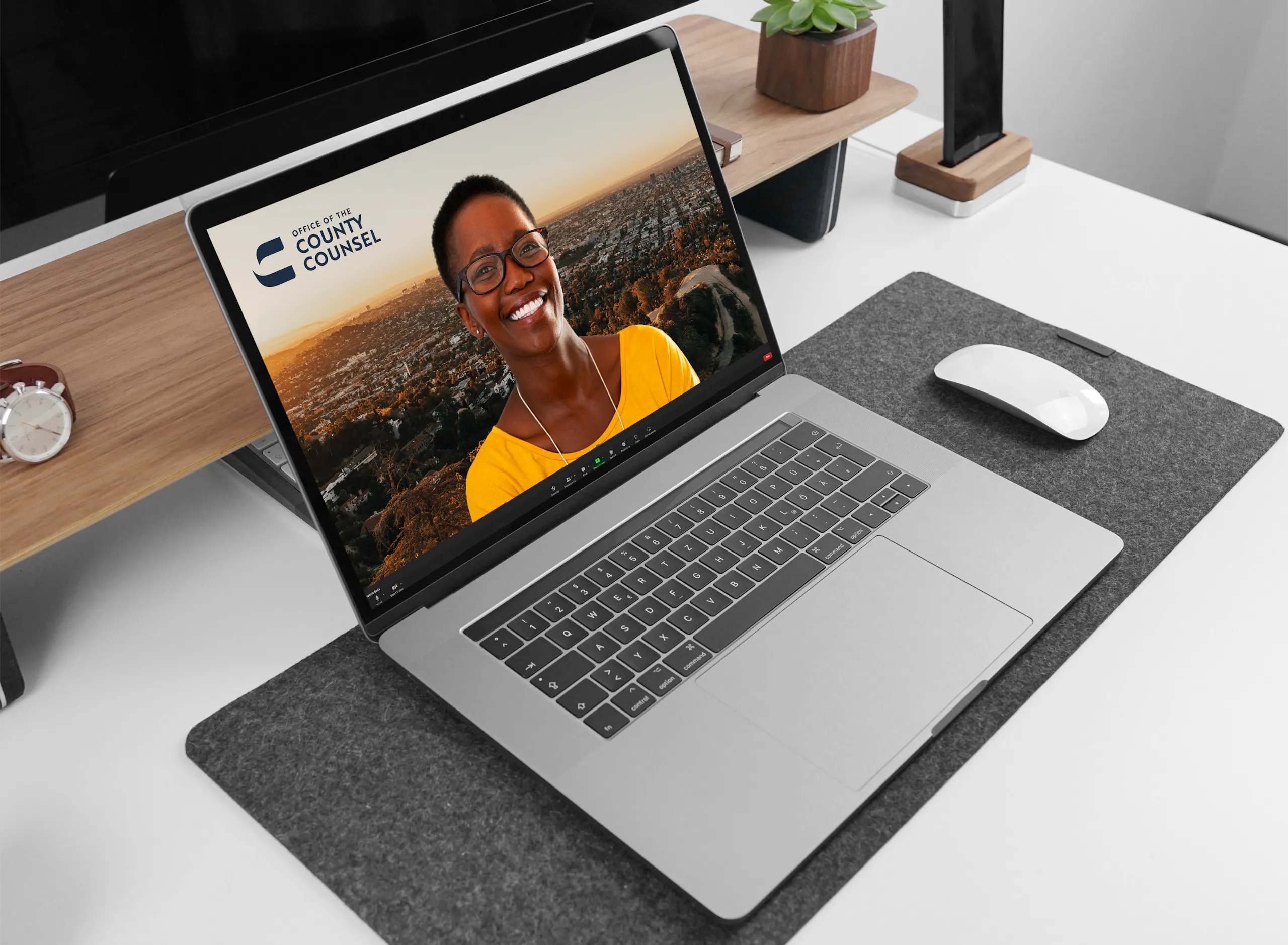 macbook with smiling person brand in the corner