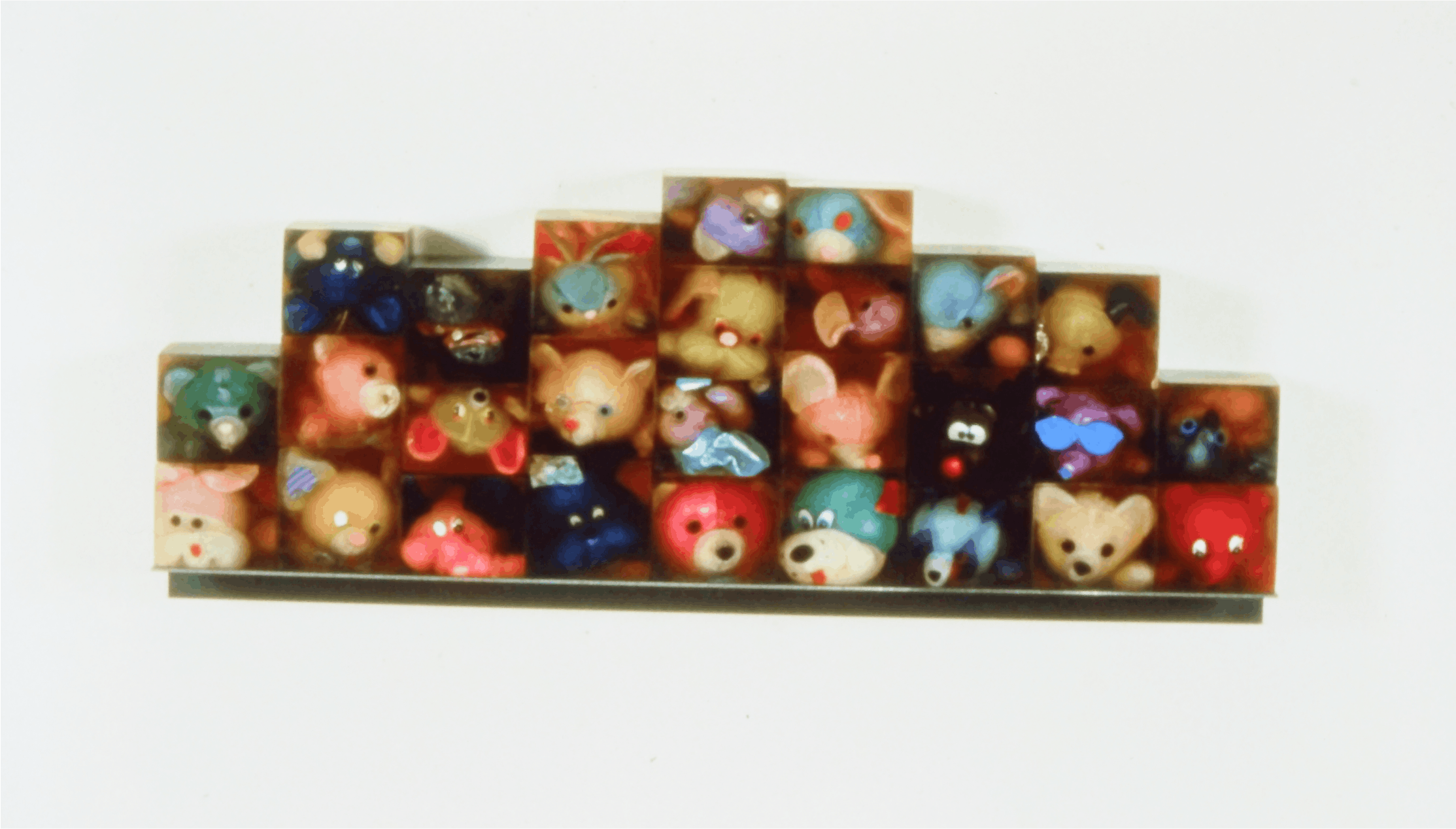 Lucy Puls, Bestoiolae Refertus Mutli (many animals), 1993, resin, stuffed animals, and steel 14x35x4