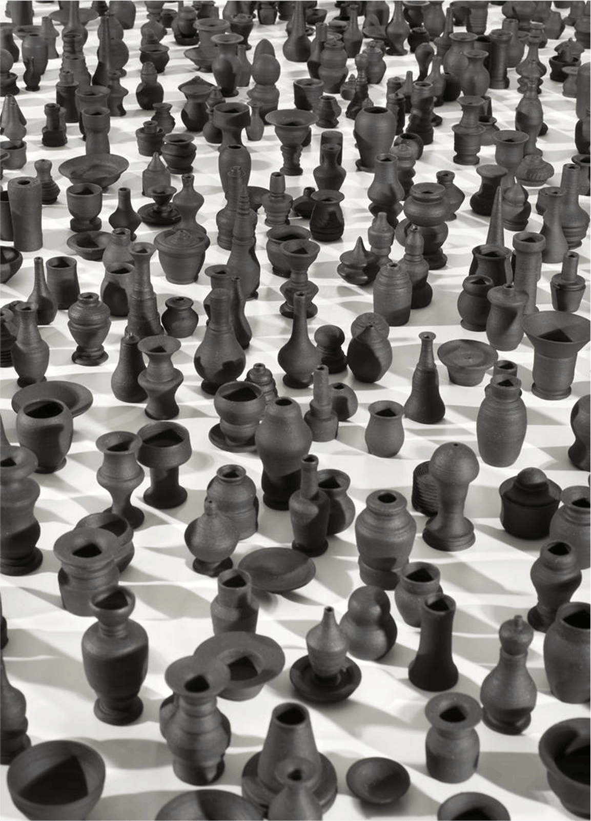 Charles LeDray, Throwing Shadows, 2008–2010, Black porcelain, Dimensions variable,