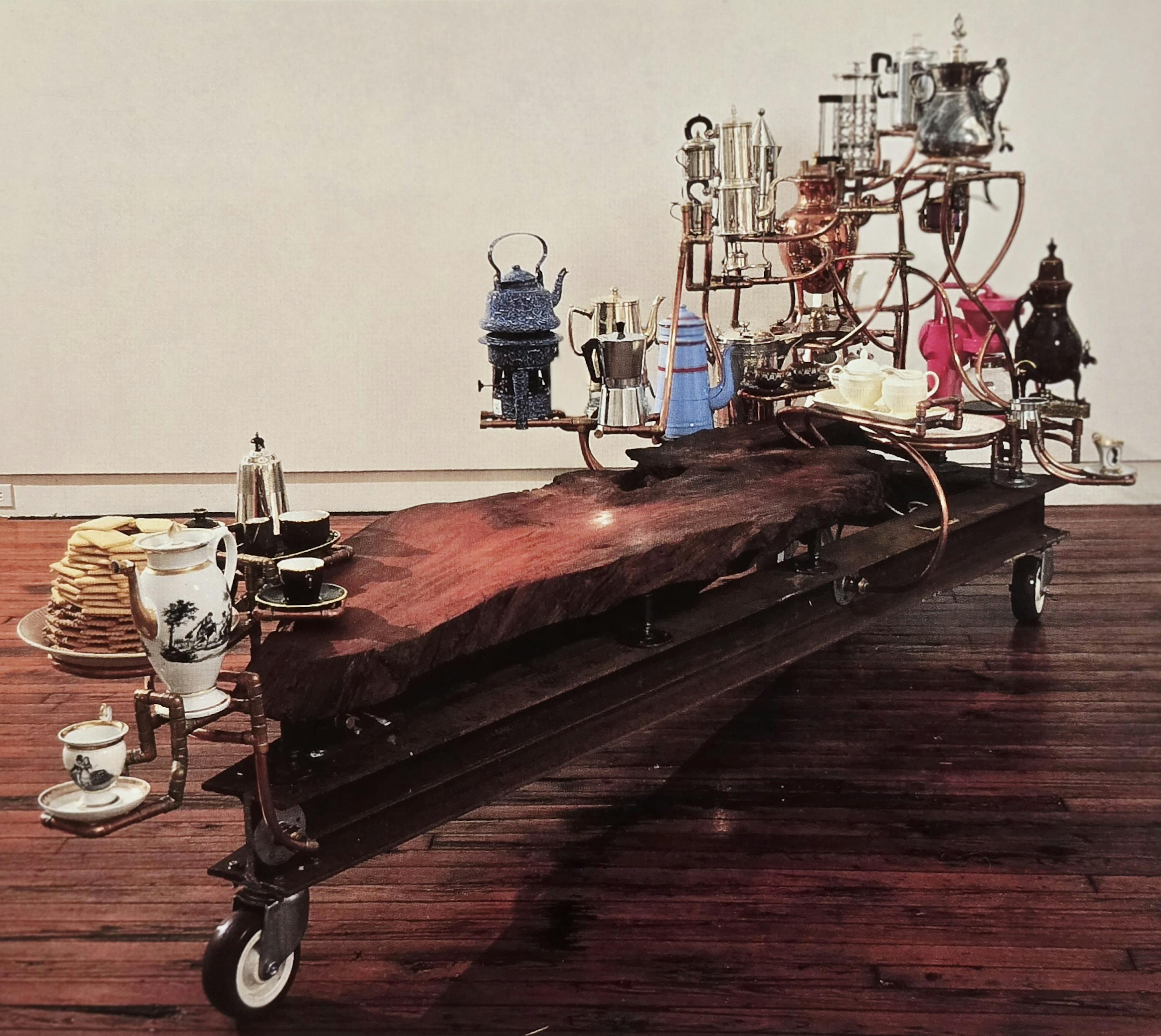 Joel Otterson, The coffee table Museum, 1989, redwood burl, antique and contemporary coffeepots, copper, brass, welder steel, wheels and mixed media
