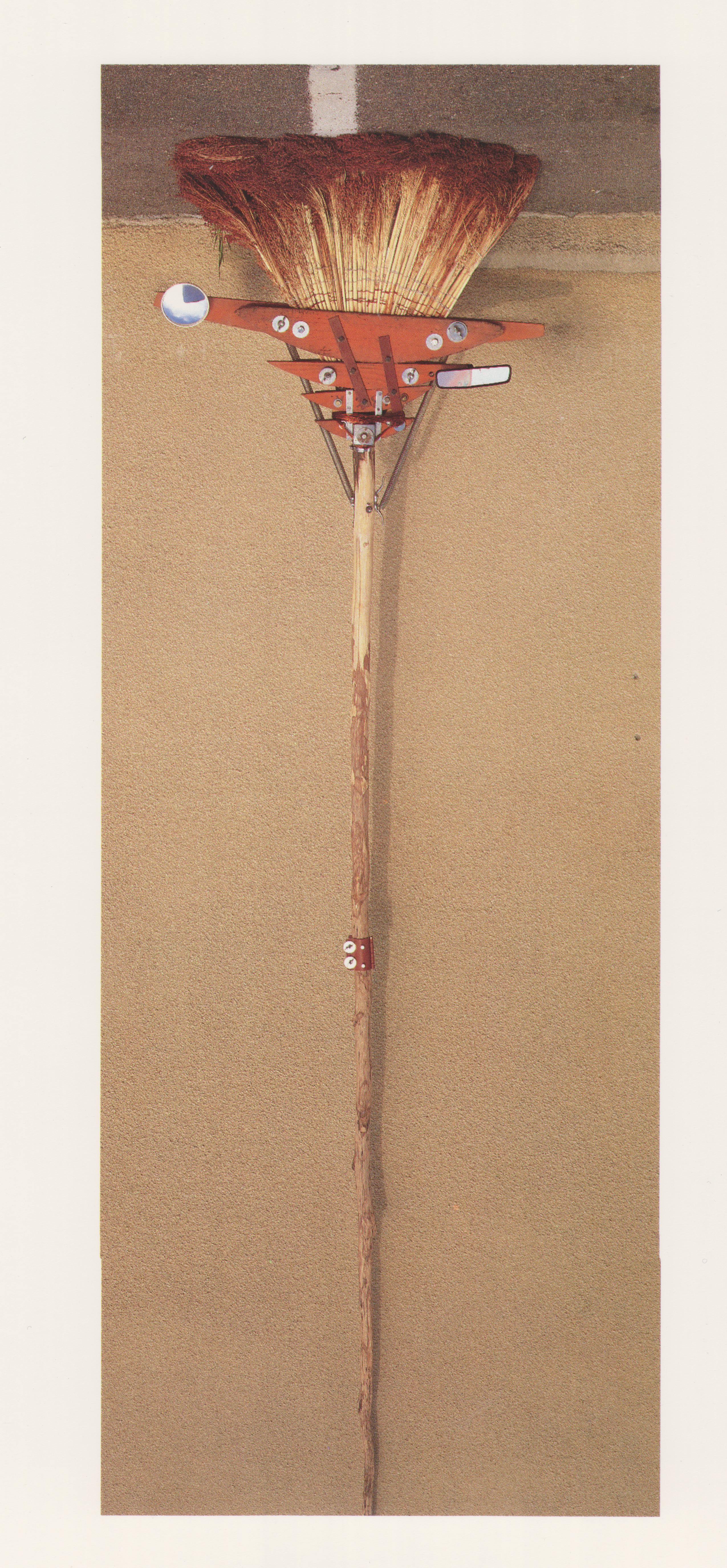 Melissa Smedley, Broom_ Practicing for the Millennium, 1995, Broomcorn, hardware, mirror, and wood, 36 x 96.png