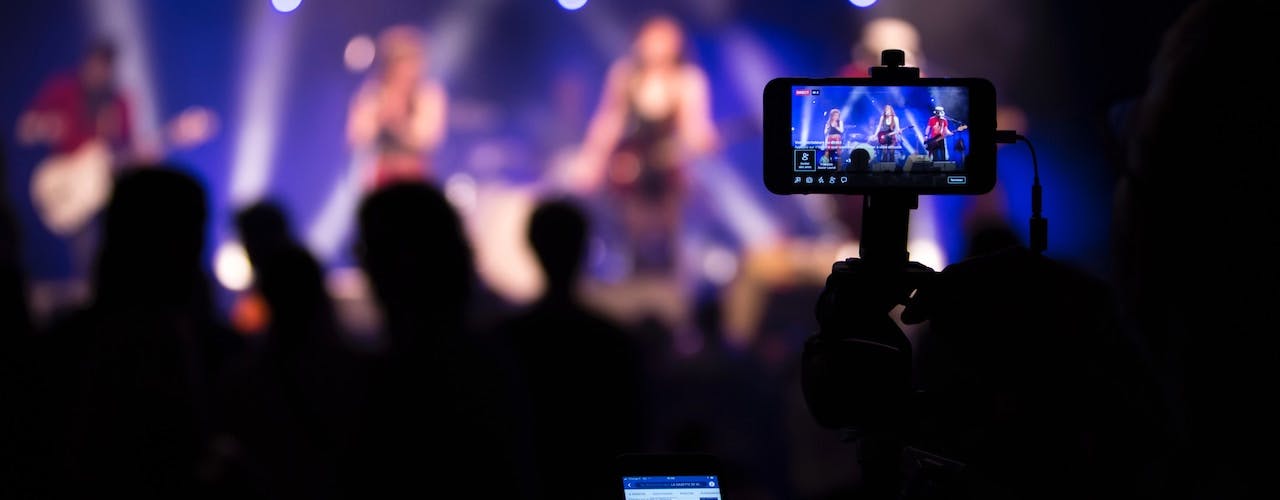 Filming a band on stage with mobile camera