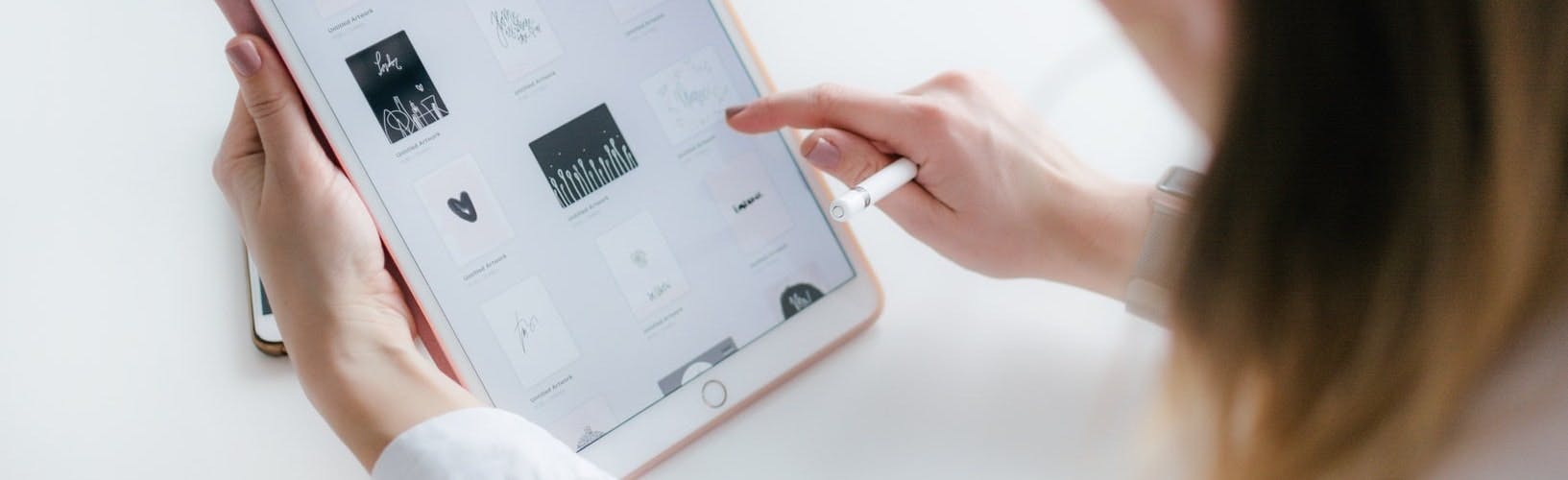 Close up of woman looking at designs on tablet