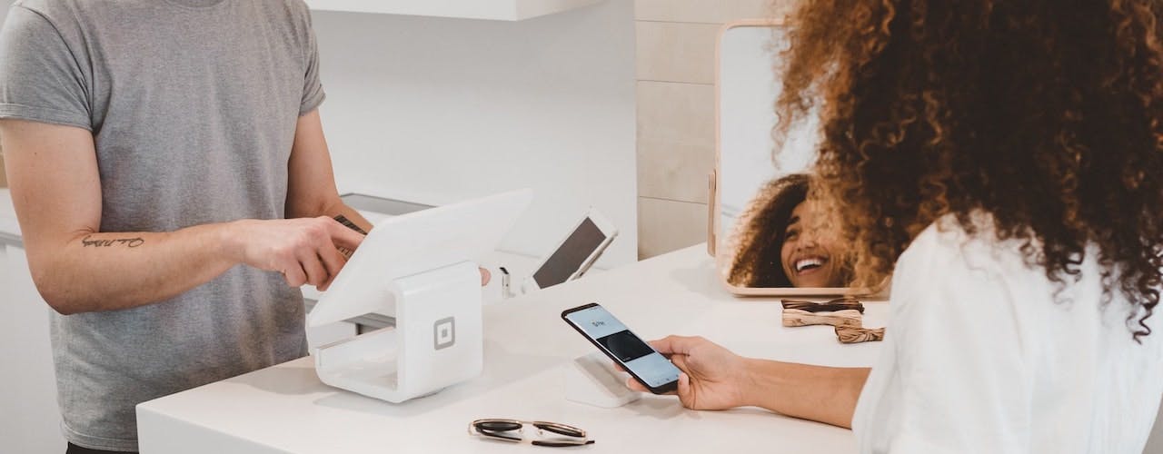 Customer paying with mobile phone