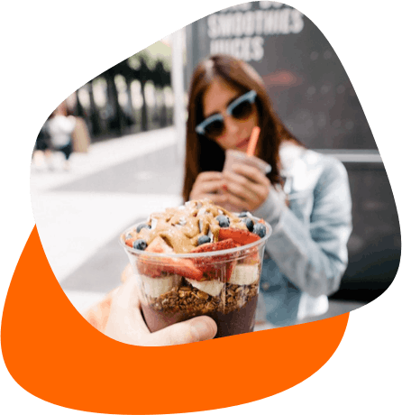 Customer influencer taking photo of acai bowl