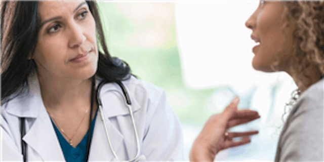 A doctor is helping a patient 